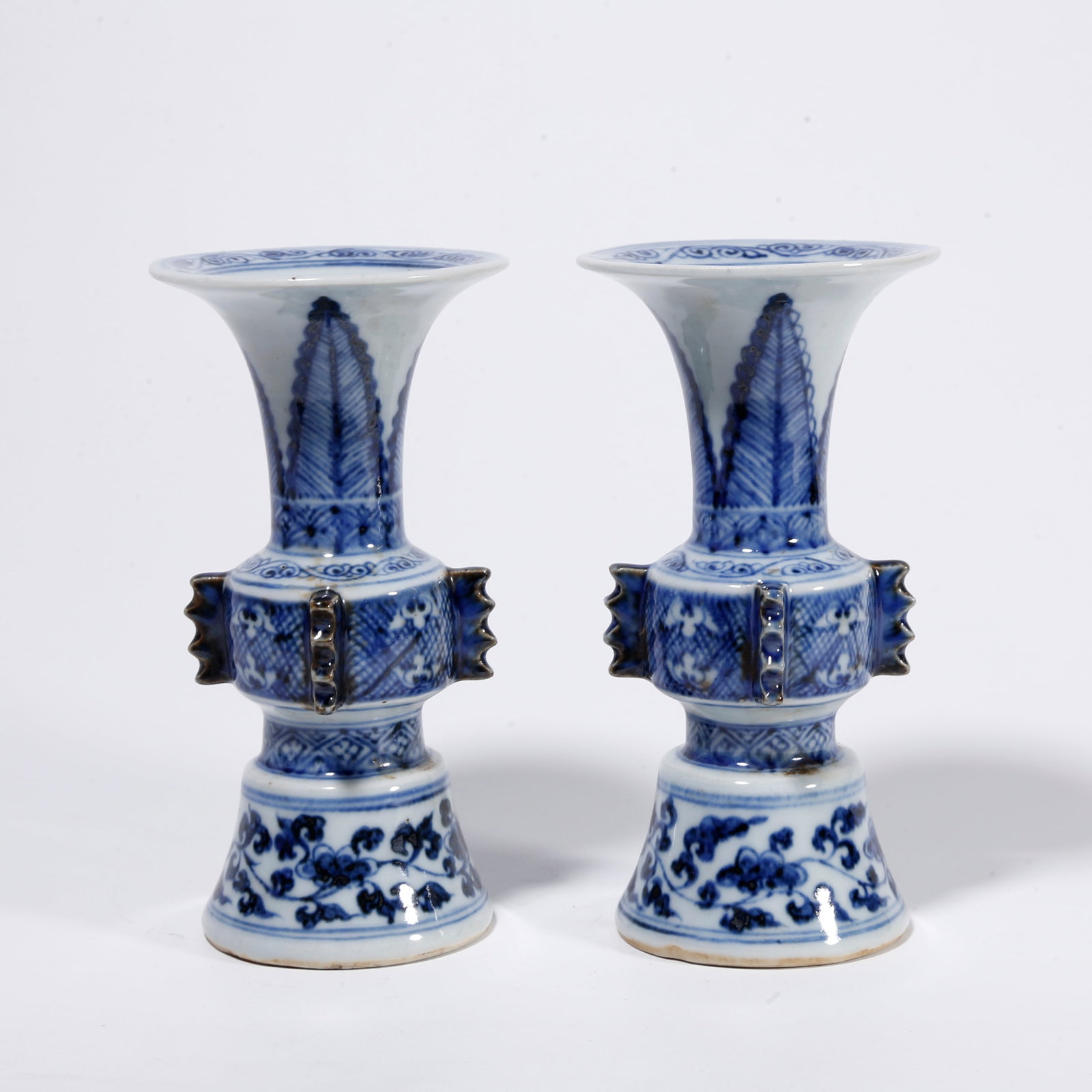 A PAIR OF BLUE AND WHITE GU-SHAPED VASES: Pair of Blue and White Gu-shaped Vases