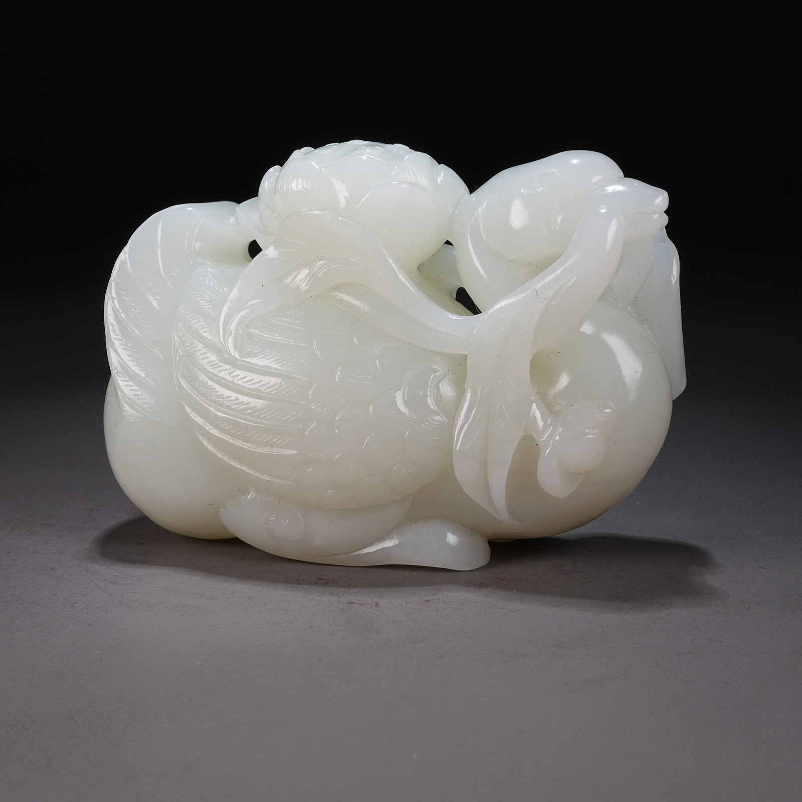A HETIAN WHITE JADE "AUSPICIOUS DUCK WITH LOTUS" ORNAMENT (1 of 9)