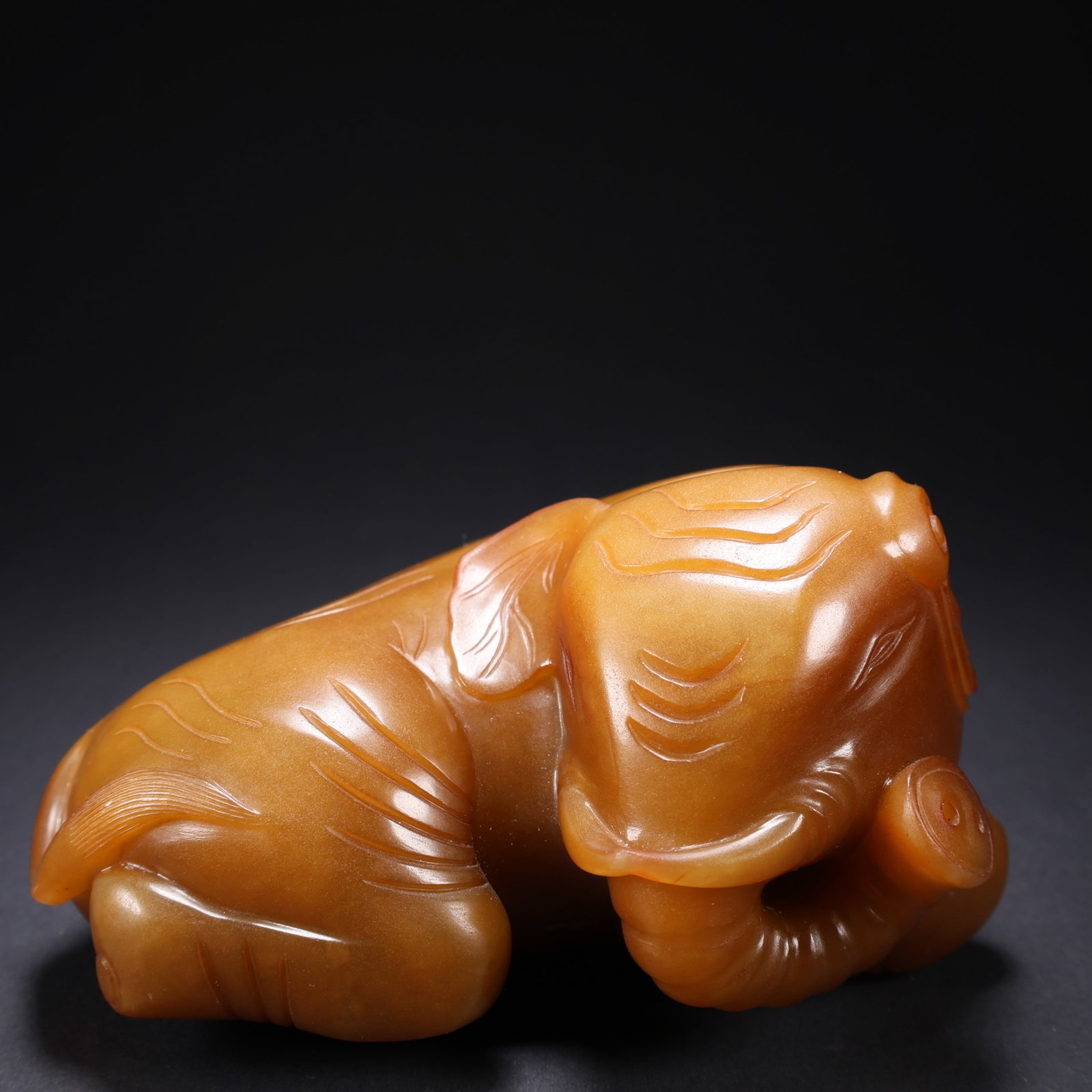 A TIANHUANG JADE "PEACE AND PROSPERITY" ELEPHANT (1 of 9)