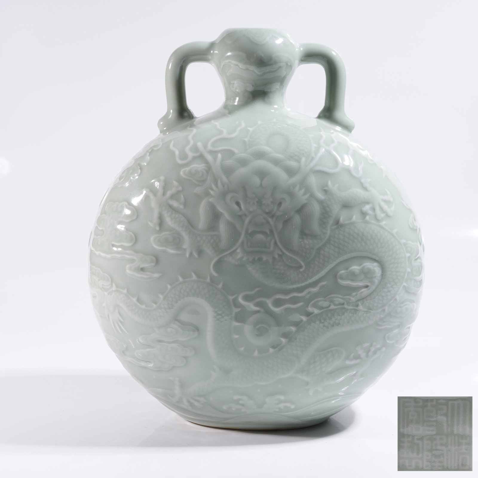 A POWDER CELADON GLAZED SCULPTED MOON FLASK WITH RIBBON EARS AND CLOUD DRAGON PATTERN (1 of 10)