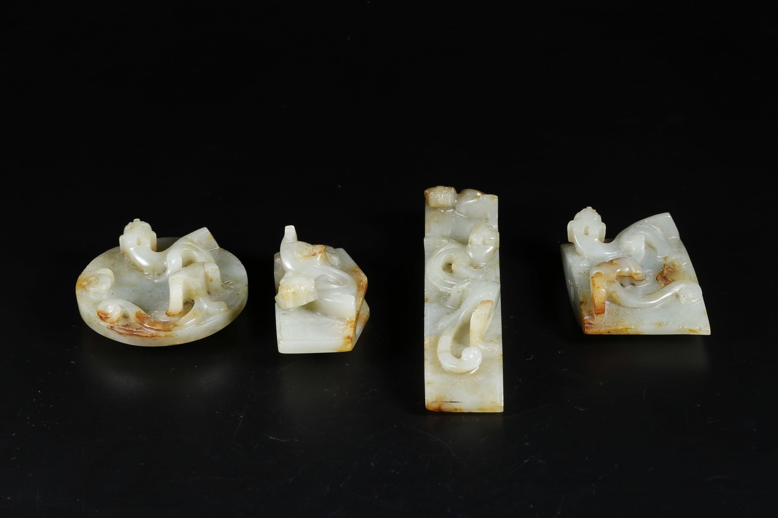 A HOTAN JADE CARVED SWORD ORNAMENTS (SET): Hotan Jade Carved Sword Ornaments (Set)