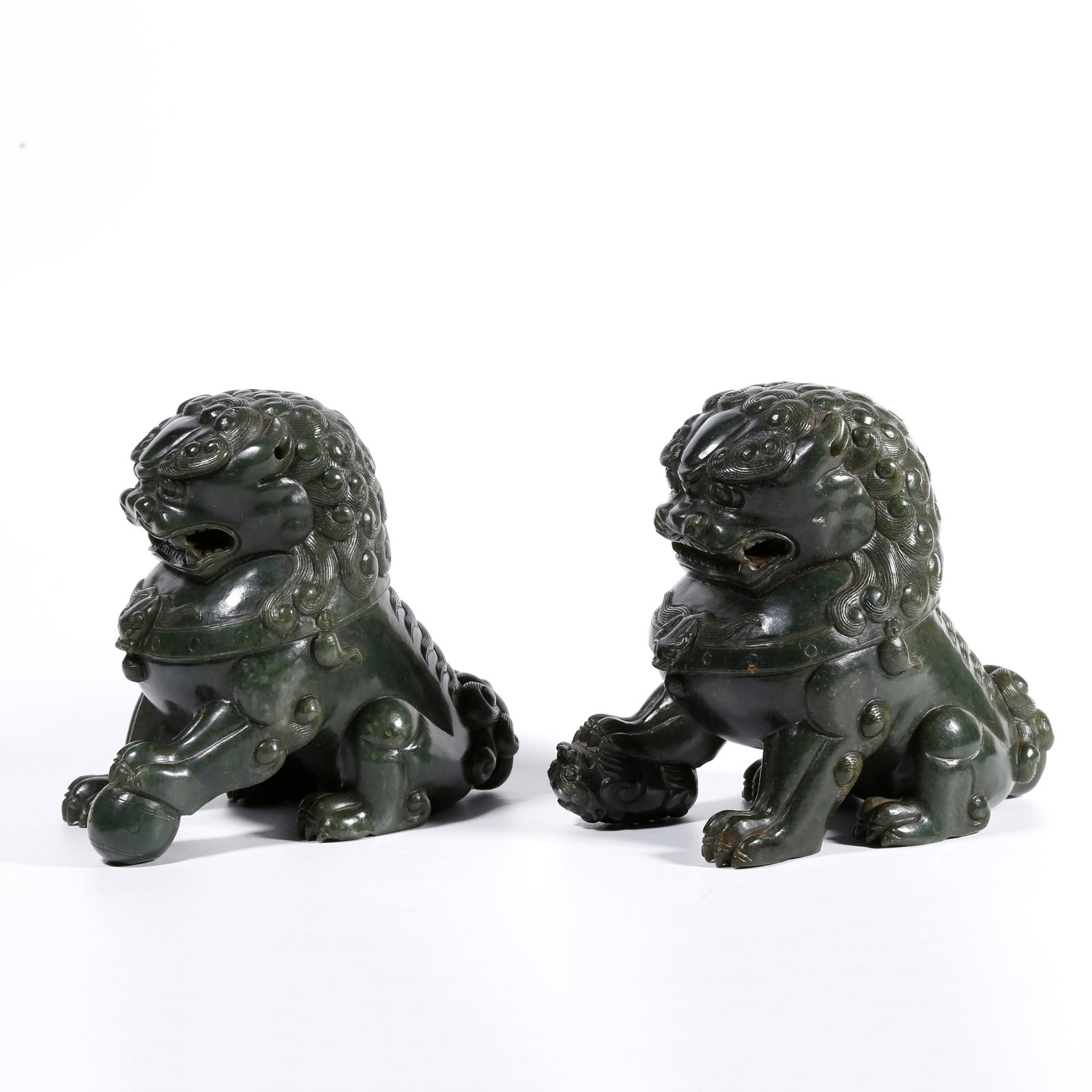 A HETIAN GREEN JADE CARVED LION ORNAMENTS (A PAIR) (1 of 10)