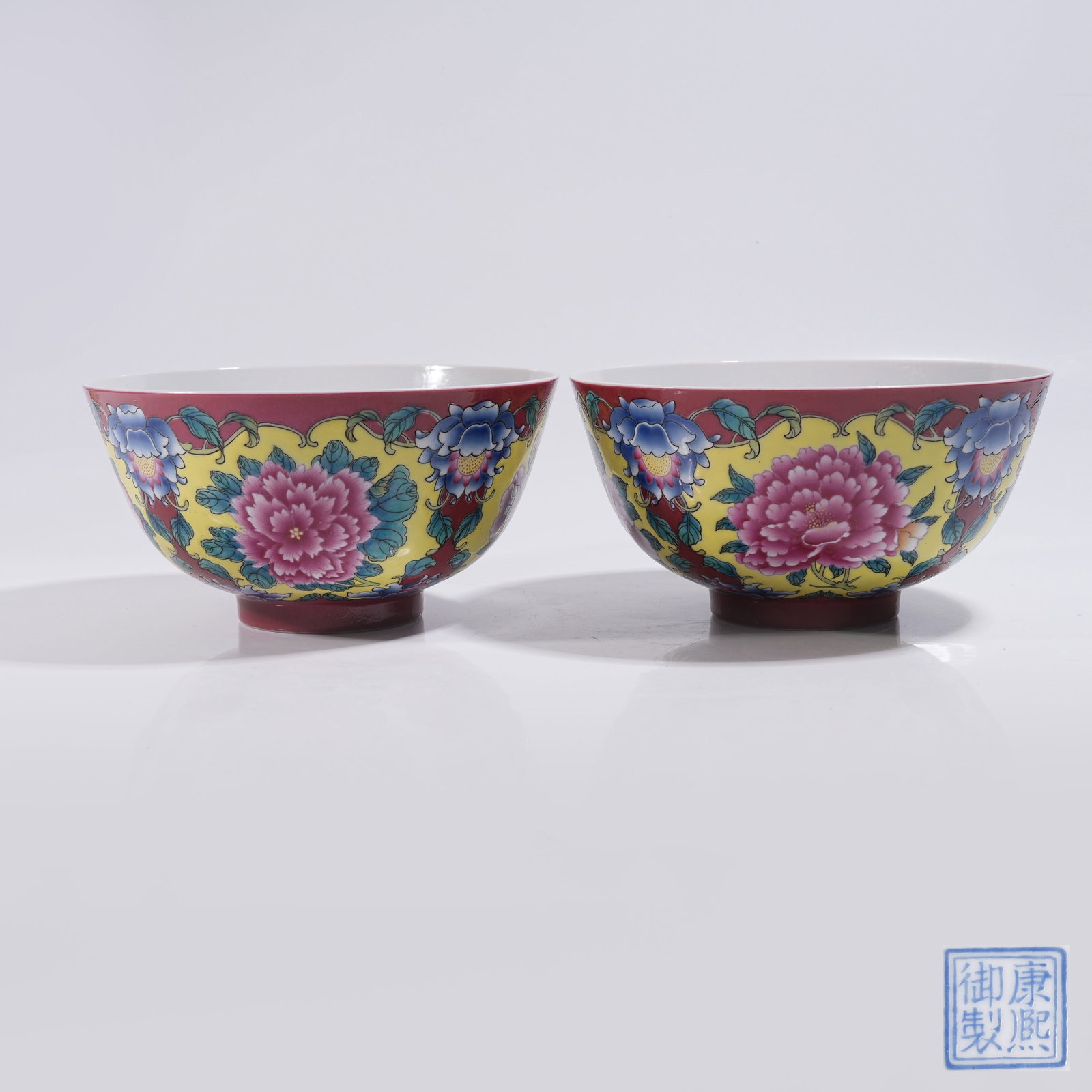 A SET OF LARGE CARMINE GROUND FAMILLE ROSE BOWLS WITH FLORAL PATTERN: Set of Large Carmine Ground Famille Rose Bowls with Floral Pattern