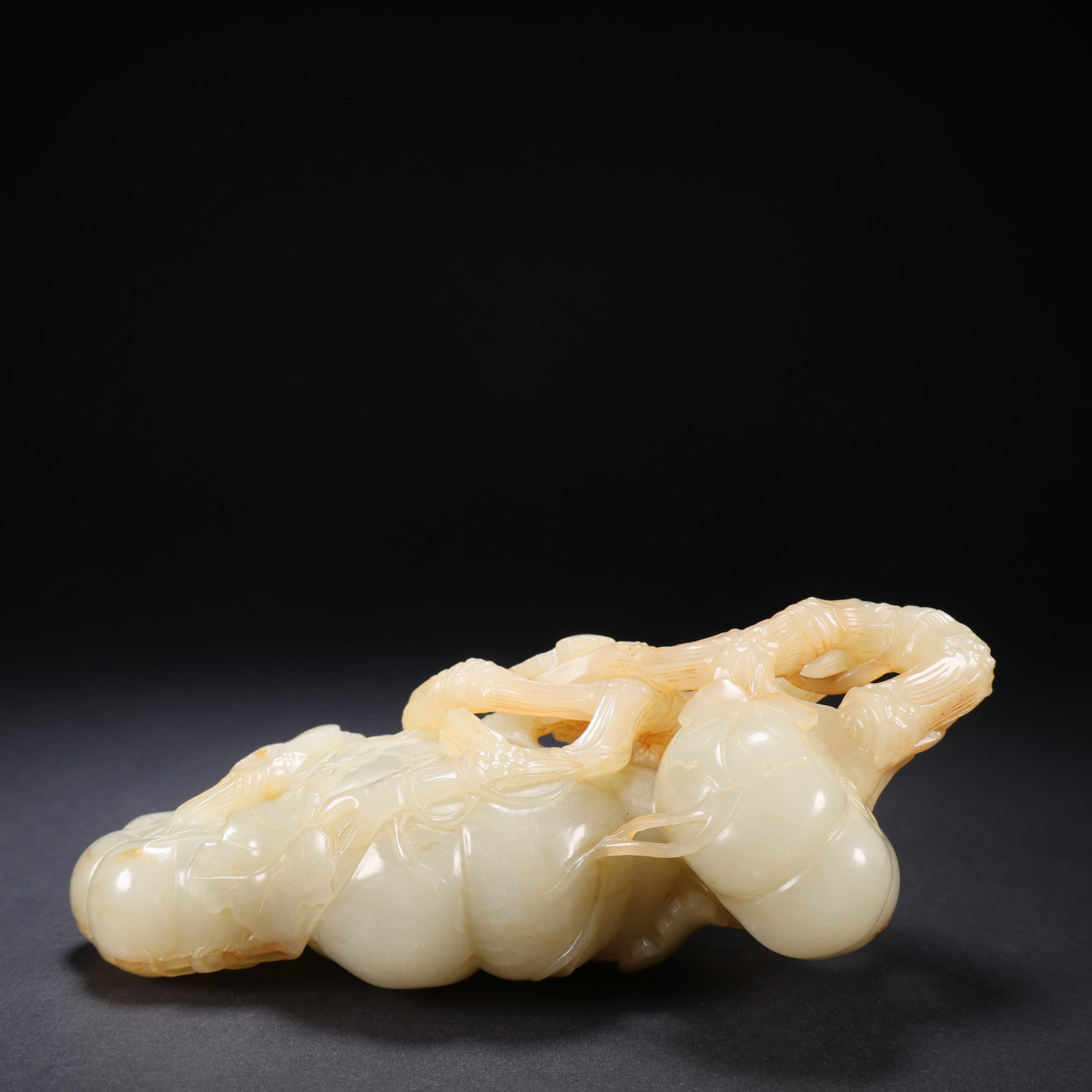 A HETIAN JADE PUMPKIN ORNAMENT (1 of 9)