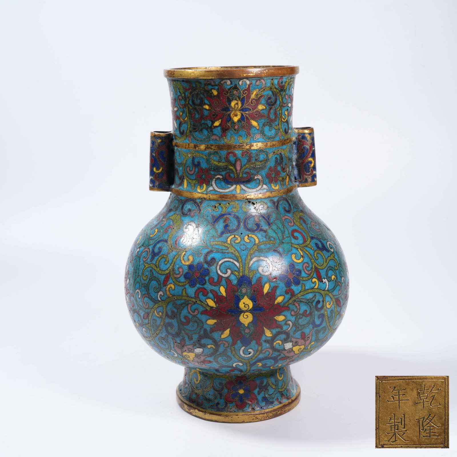 A CLOISONNÉ PIERCED-EAR VASE WITH INTERLOCKING FLORAL PATTERN: Cloisonné Pierced-ear Vase with Interlocking Floral Pattern