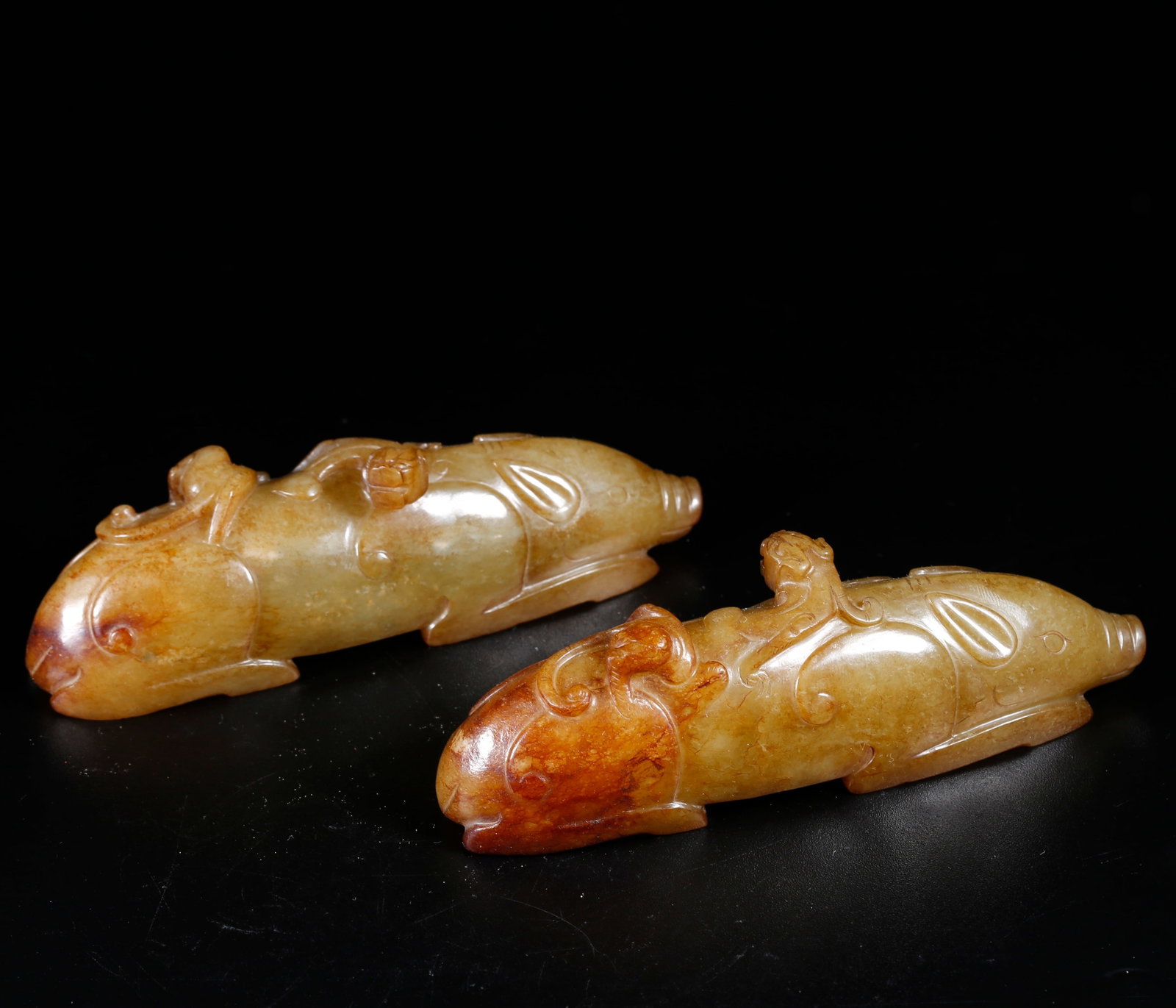 A HOTAN JADE CARVED BEAST-SHAPED ORNAMENTS (PAIR) (1 of 10)