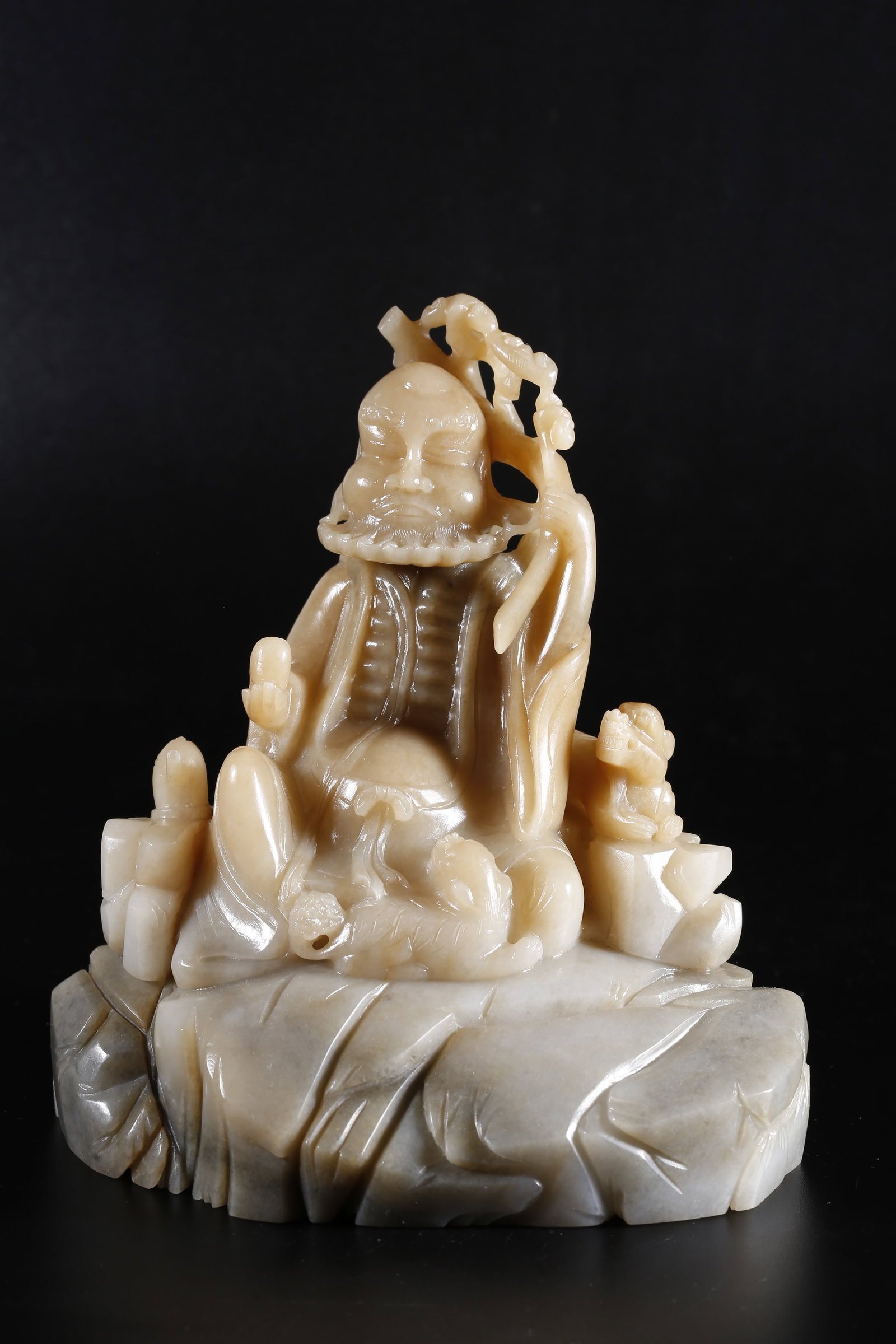 A HOTAN JADE CARVED ARHAT STATUE: Hotan Jade Carved Arhat Statue