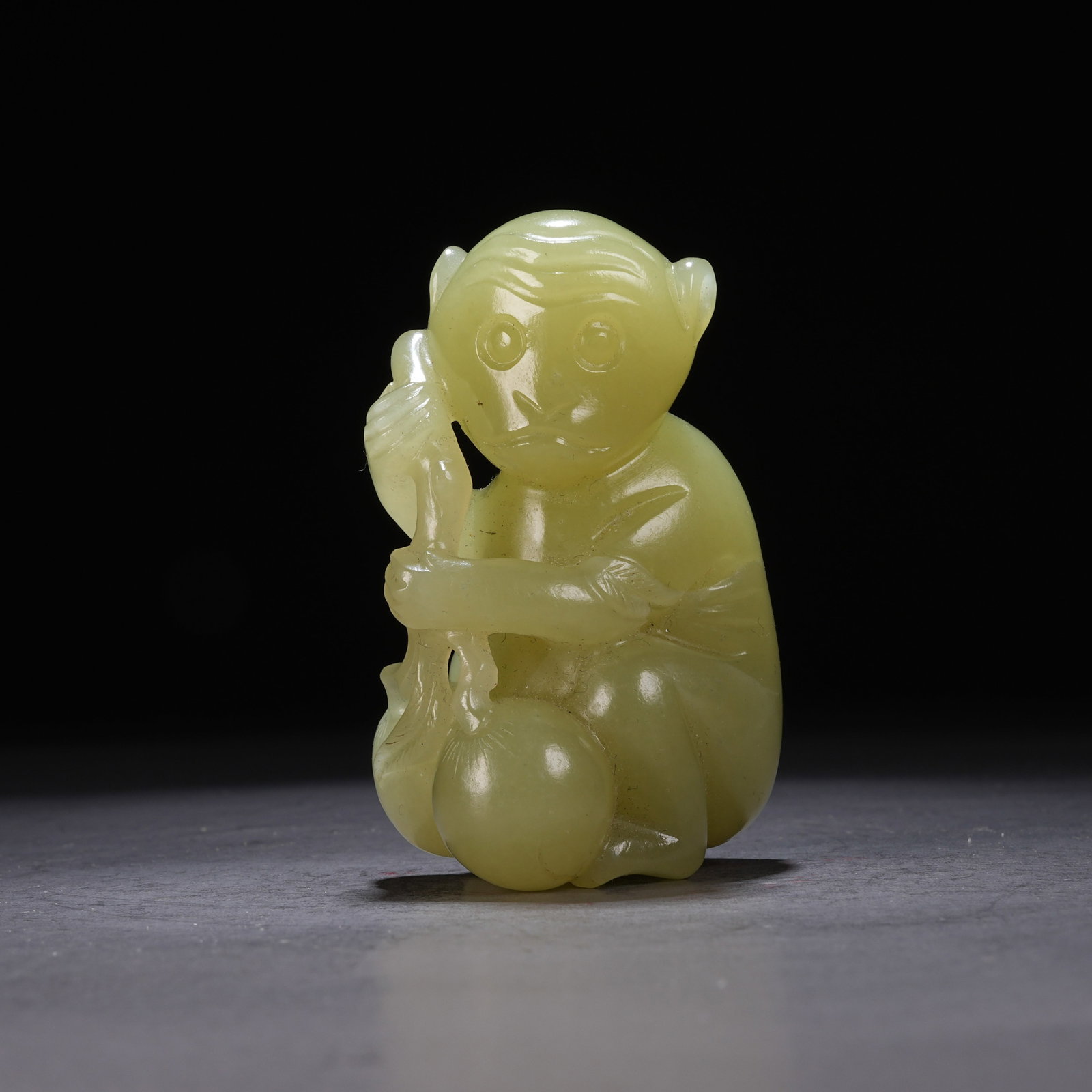 A HETIAN YELLOW JADE "MONKEY PRESENTING LONGEVITY" ORNAMENT (1 of 9)
