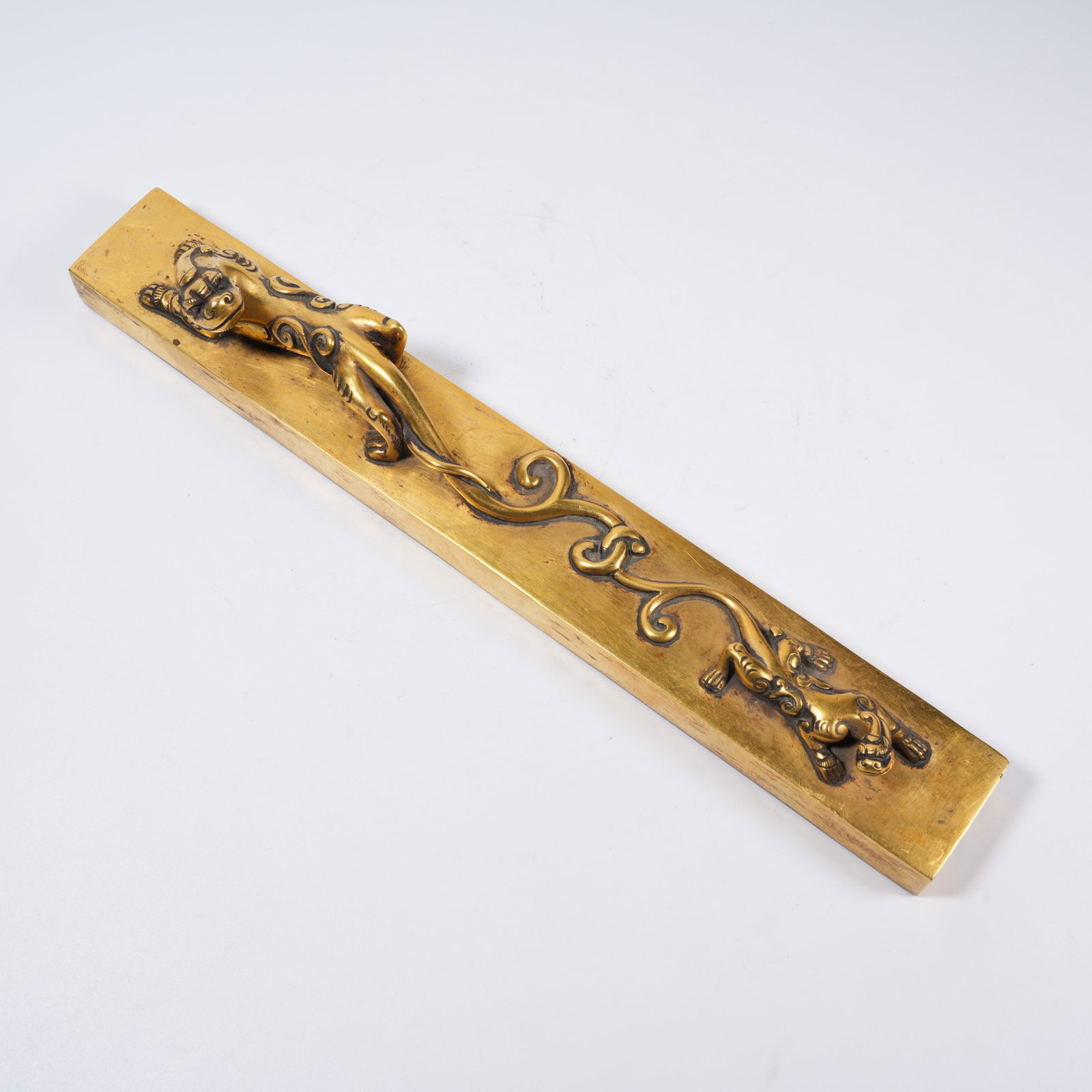 A GILT BRONZE PAPERWEIGHT WITH CHILONG PATTERN (1 of 8)