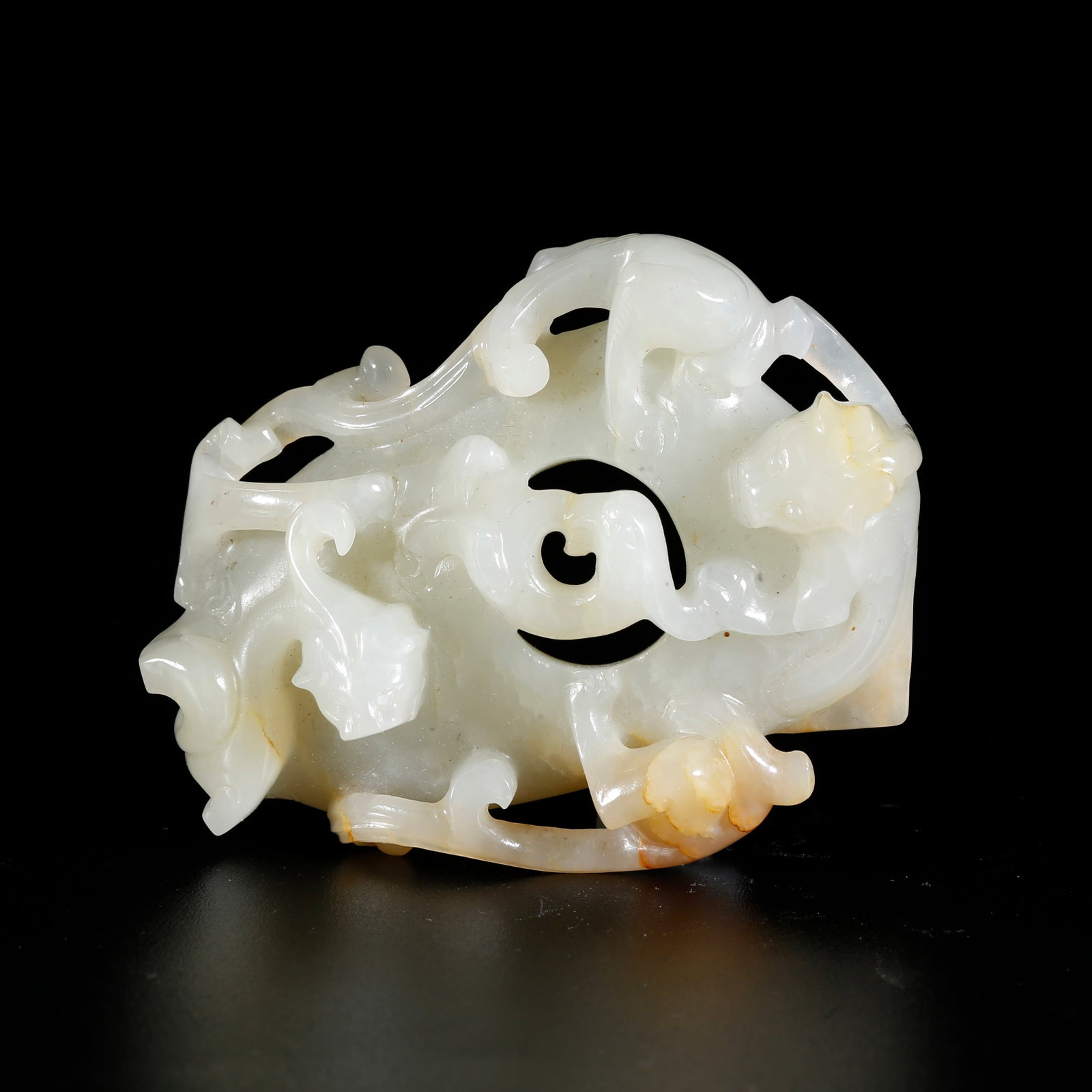 A HETIAN JADE CARVED DRAGON-MOTIF CHICKEN-HEART PENDANT (1 of 10)
