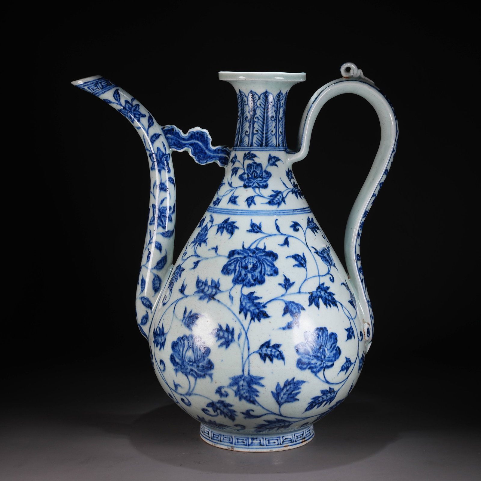 A BLUE-AND-WHITE LARGE EWER WITH SCROLLING FLORAL MOTIFS: Blue-and-White Large Ewer with Scrolling Floral Motifs