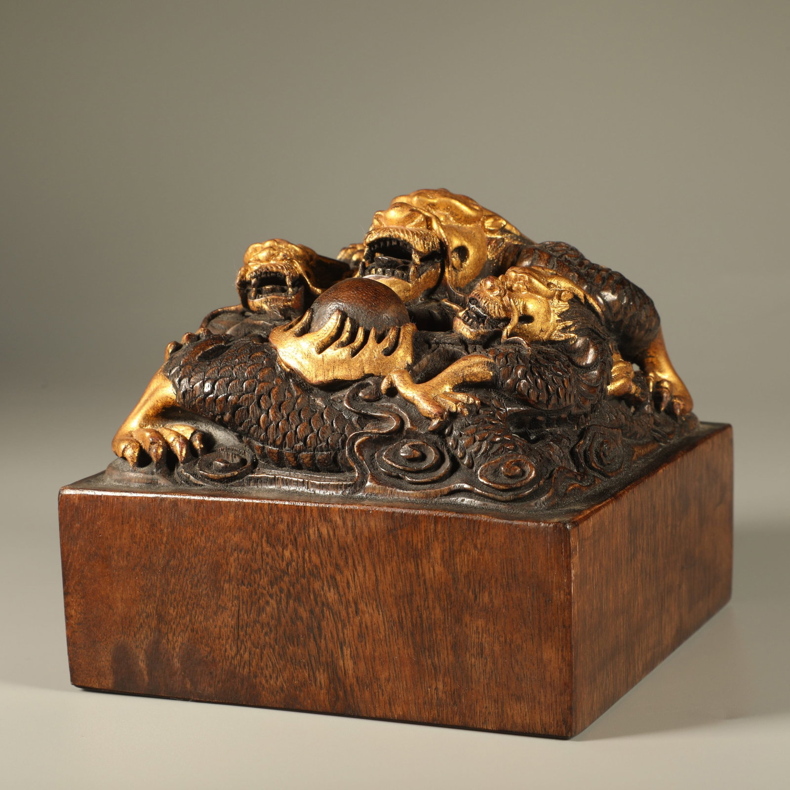 A AGARWOOD SEAL CARVED WITH DRAGON BUTTON AND GOLD TRACED DECORATION: Agarwood Seal Carved with Dragon Button and Gold Traced Decoration