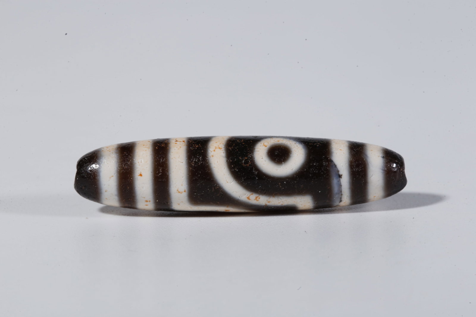 A TWO-EYED DZI BEAD - 2