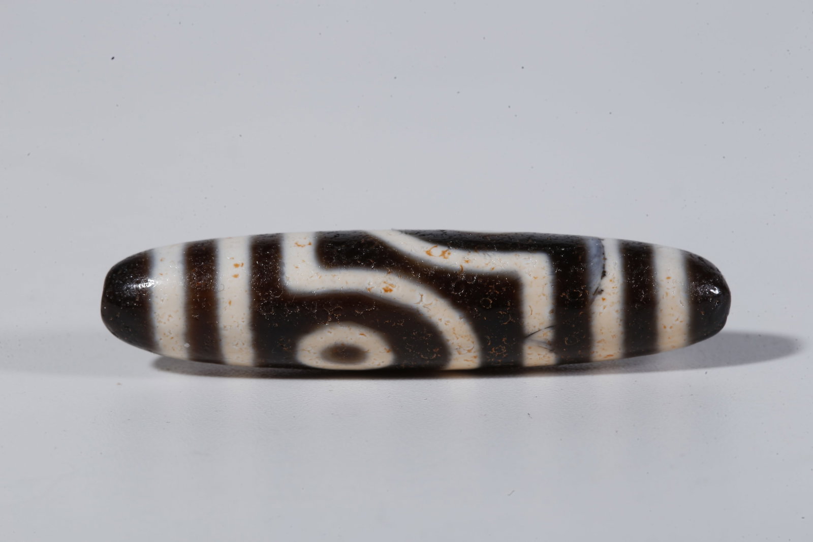 A TWO-EYED DZI BEAD - 3