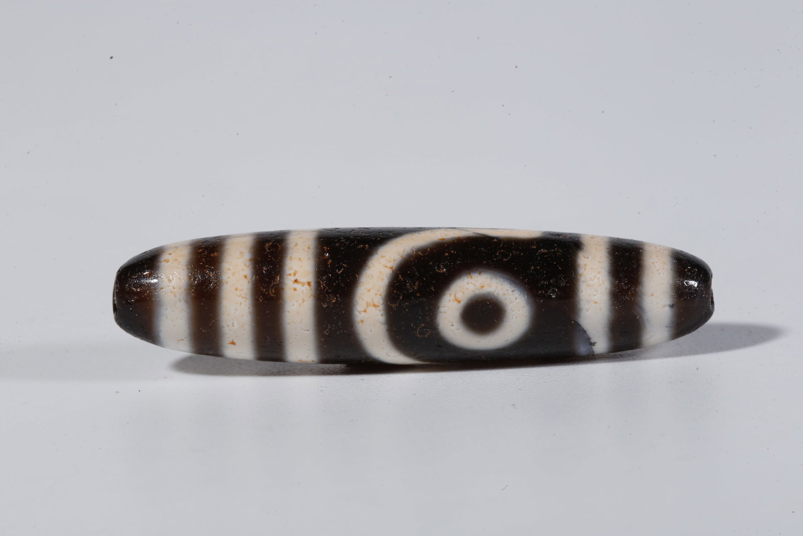 A TWO-EYED DZI BEAD - 5