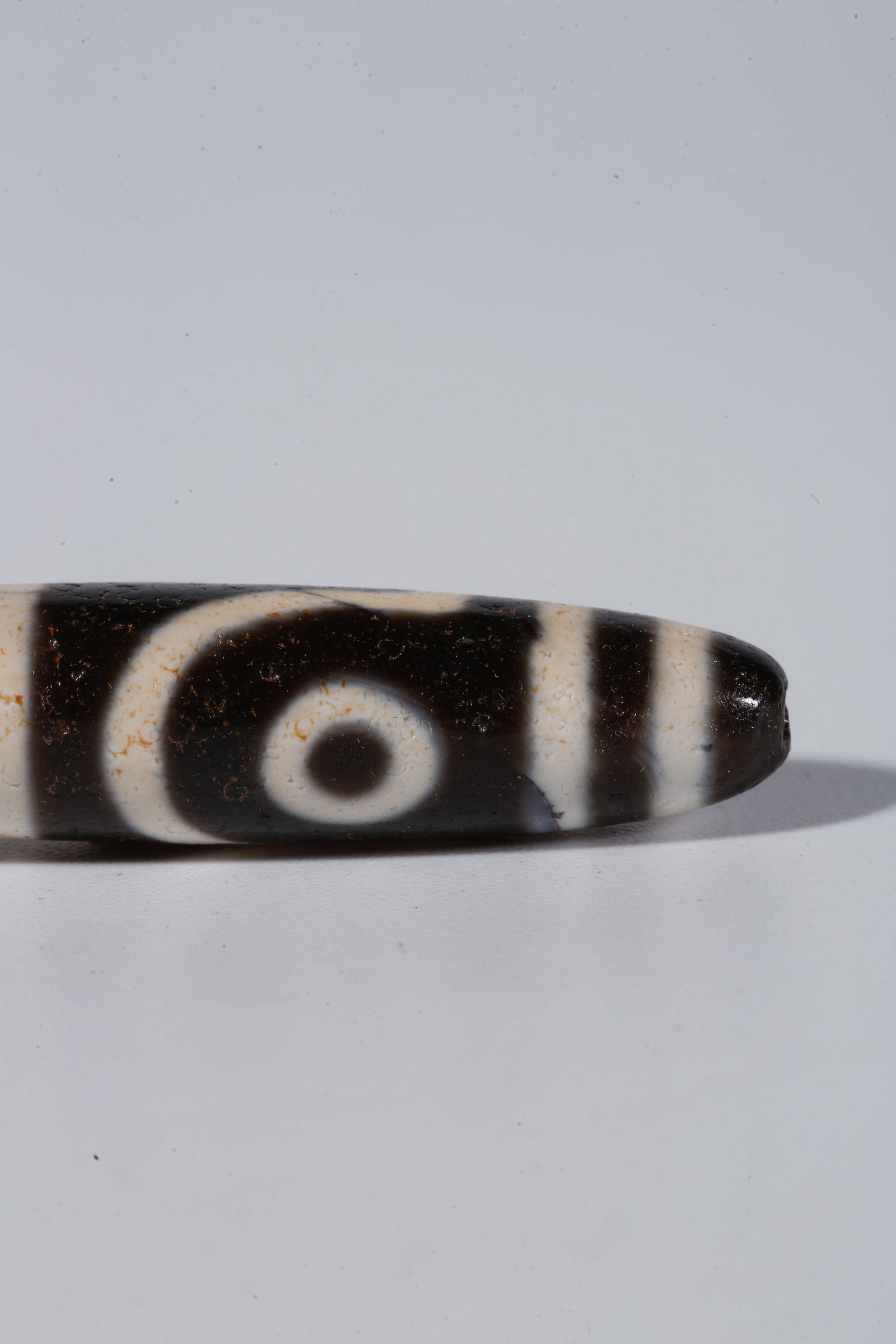 A TWO-EYED DZI BEAD - 6