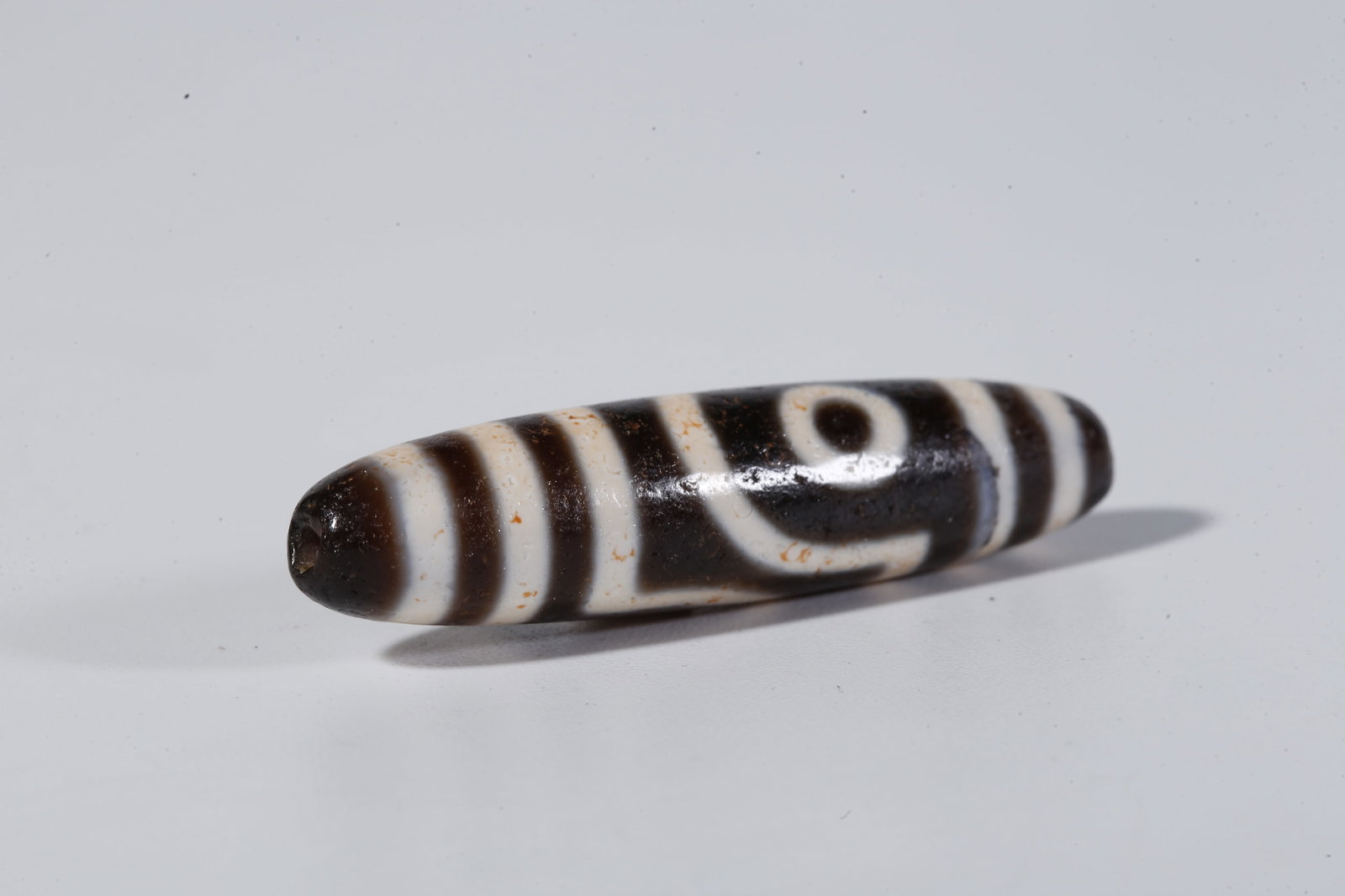 A TWO-EYED DZI BEAD - 7
