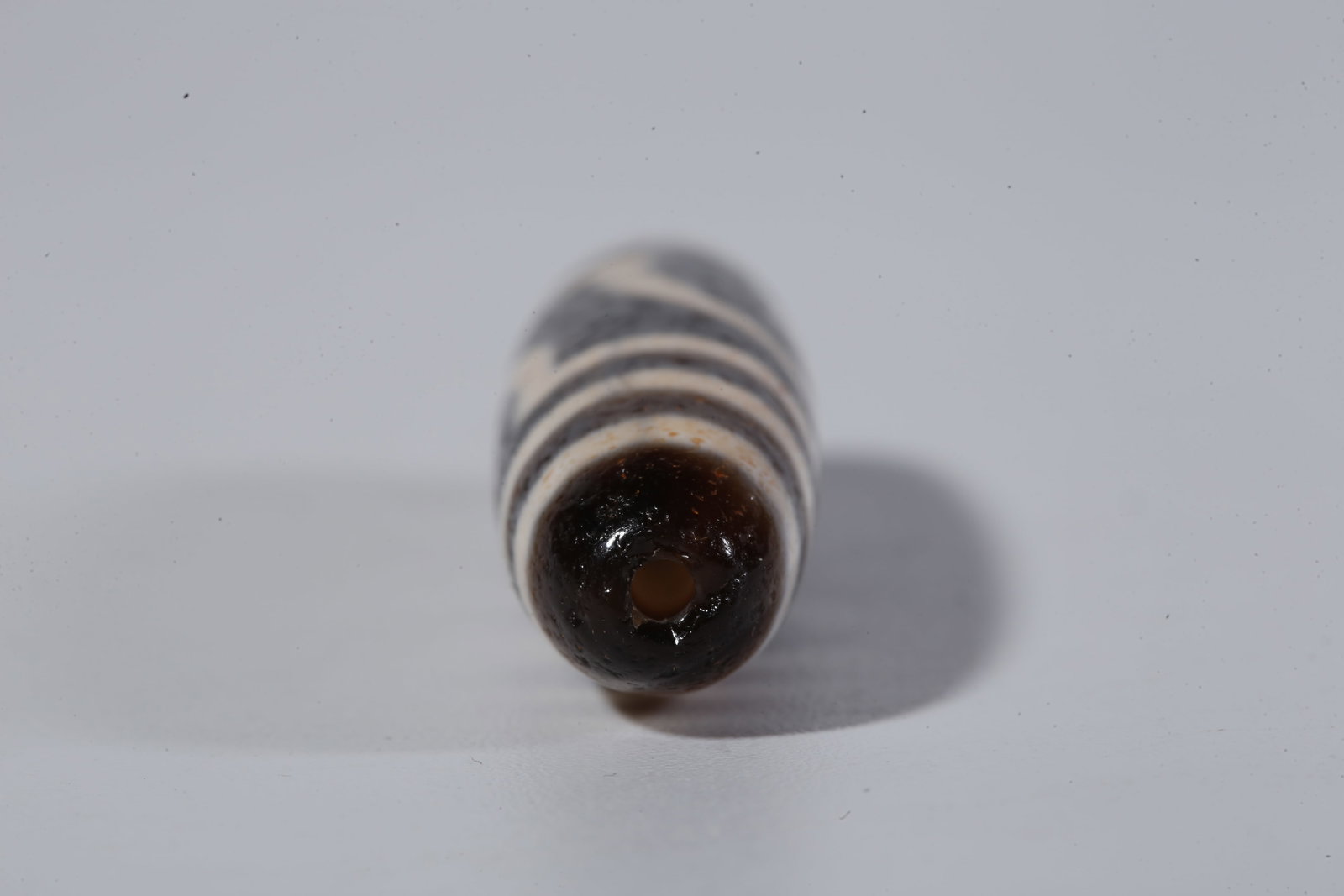 A TWO-EYED DZI BEAD - 8