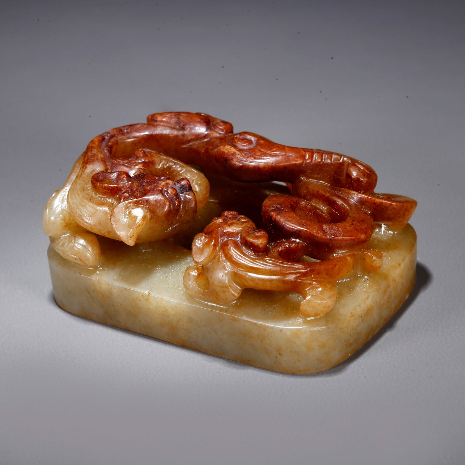 A CARVED HETIAN JADE BELT PLAQUE WITH DRAGON PATTERN: Carved Hetian Jade Belt Plaque with Dragon Pattern