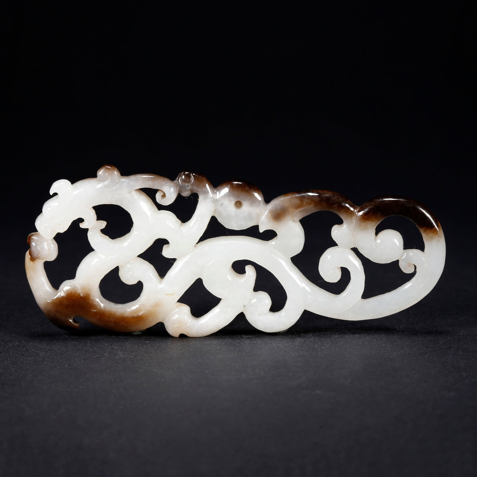A HETIAN JADE CHI-DRAGON-SHAPED FIGURINE: Hetian Jade Chi-Dragon-Shaped Figurine