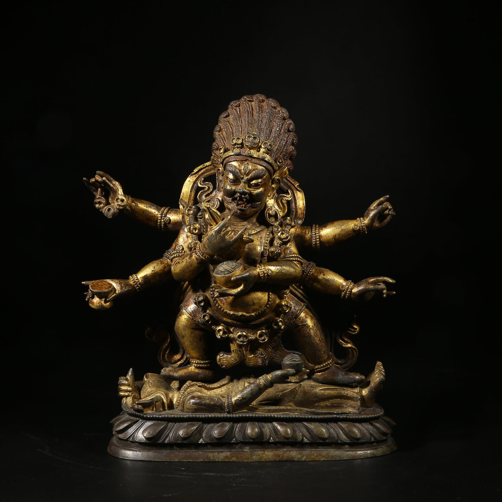 A GILT-BRONZE STATUE OF SIX-ARMED MAH?K?LA (1 of 8)