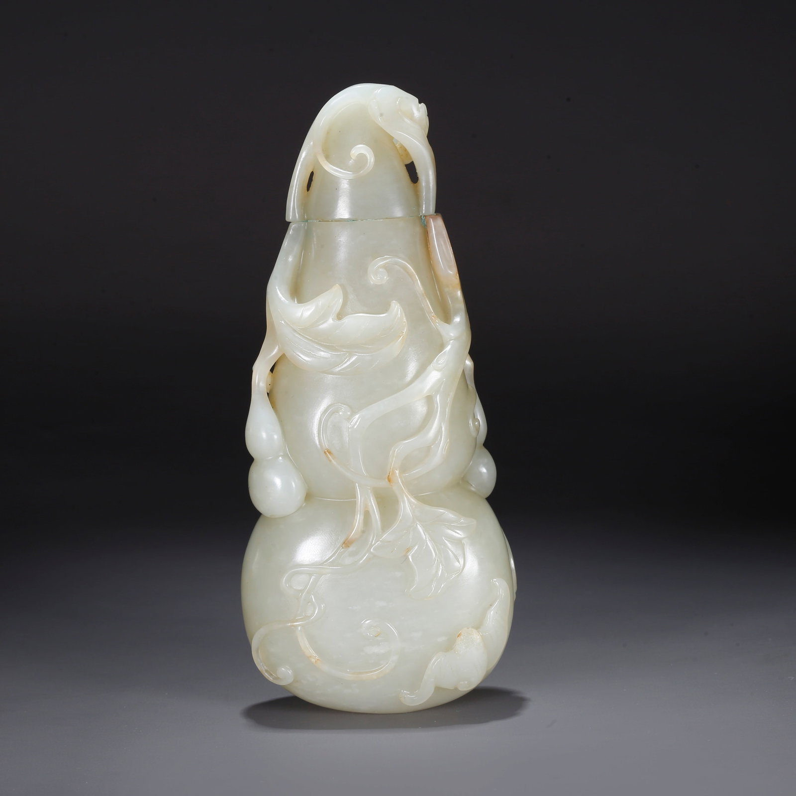 A CARVED HETIAN JADE GOURD-SHAPED ORNAMENT (1 of 10)