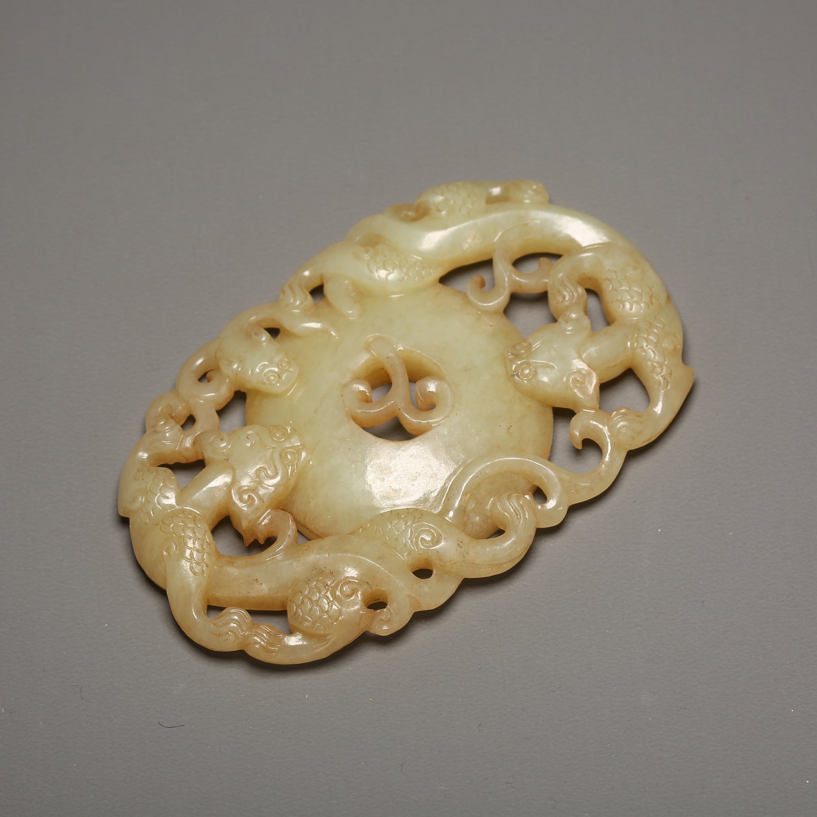 A HETIAN JADE BI DISC WITH TWIN DRAGONS EMERGING FROM CLOUDS (1 of 9)