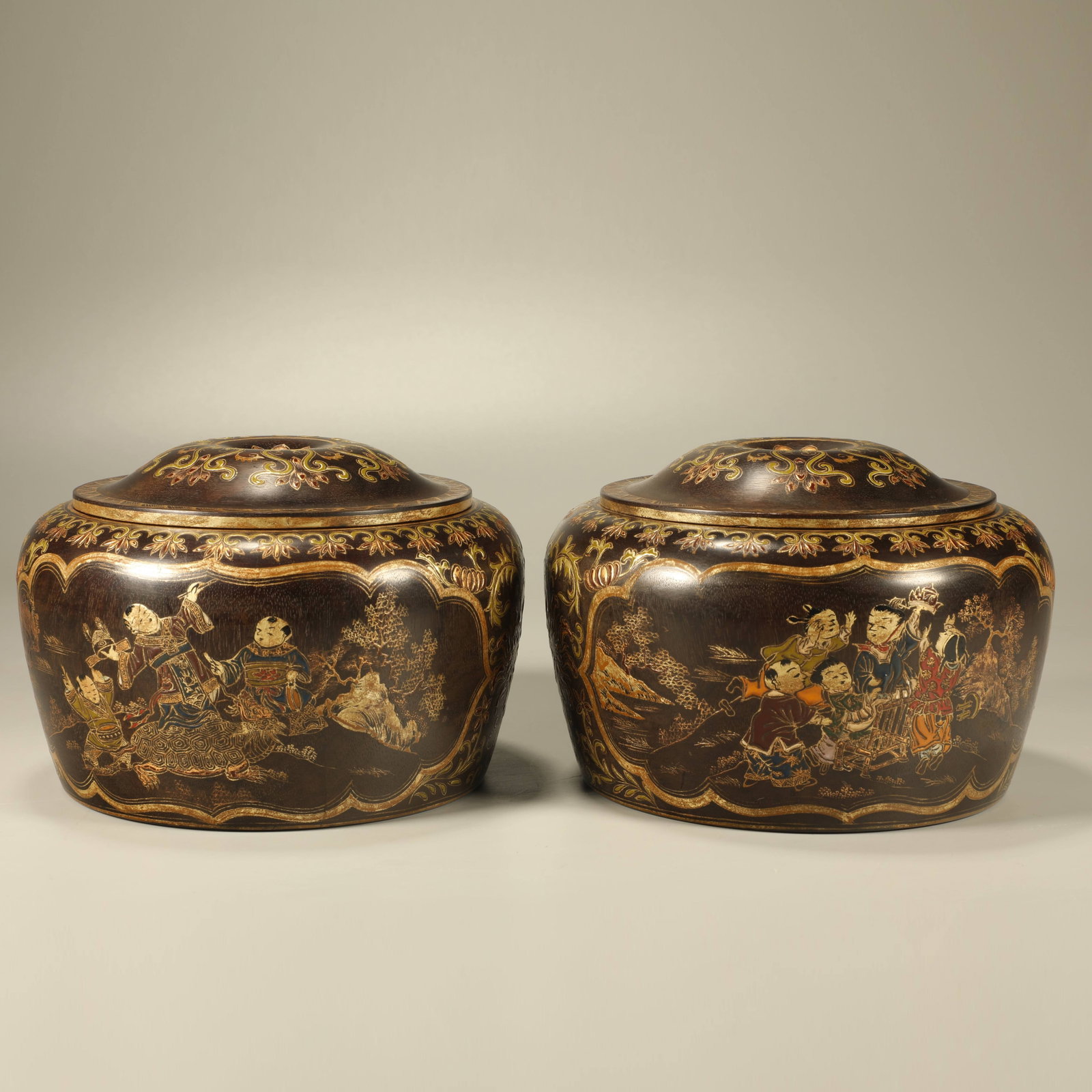 A PAIR OF RED SANDALWOOD GO JARS PAINTED WITH LANDSCAPE AND FIGURES IN GOLD TRACED COLOUR (1 of 6)