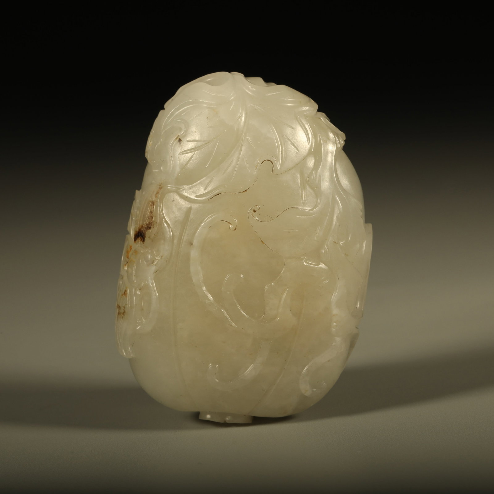 A HETIAN JADE PENDANT CARVED WITH SUCCESSIVE MELONS PATTERN: Hetian jade pendant carved with successive melons pattern