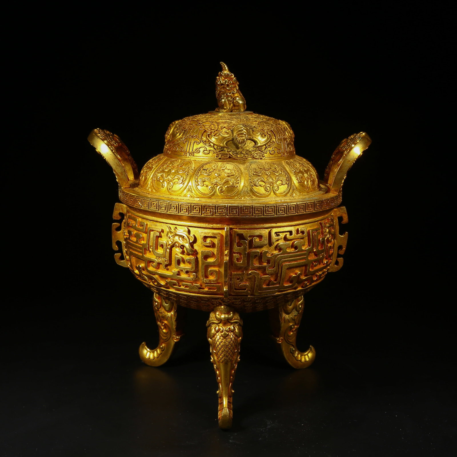 A GILT BRONZE THREE-LEGGED CENSER WITH KUI-DRAGON MOTIF (1 of 9)