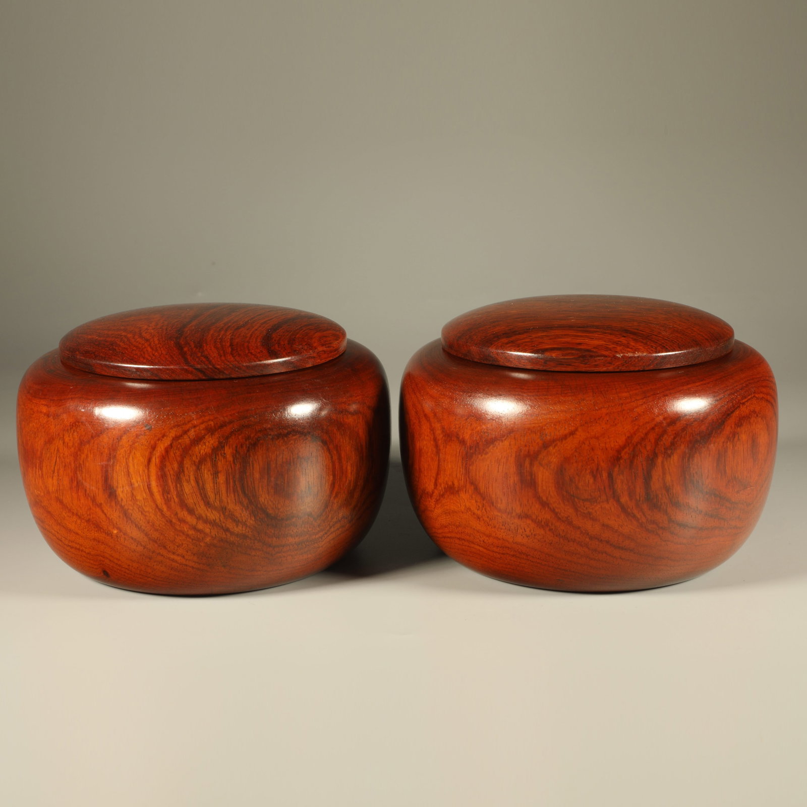 A PAIR OF PLAIN HUANGHUALI GO JARS: Pair of Plain Huanghuali Go Jars