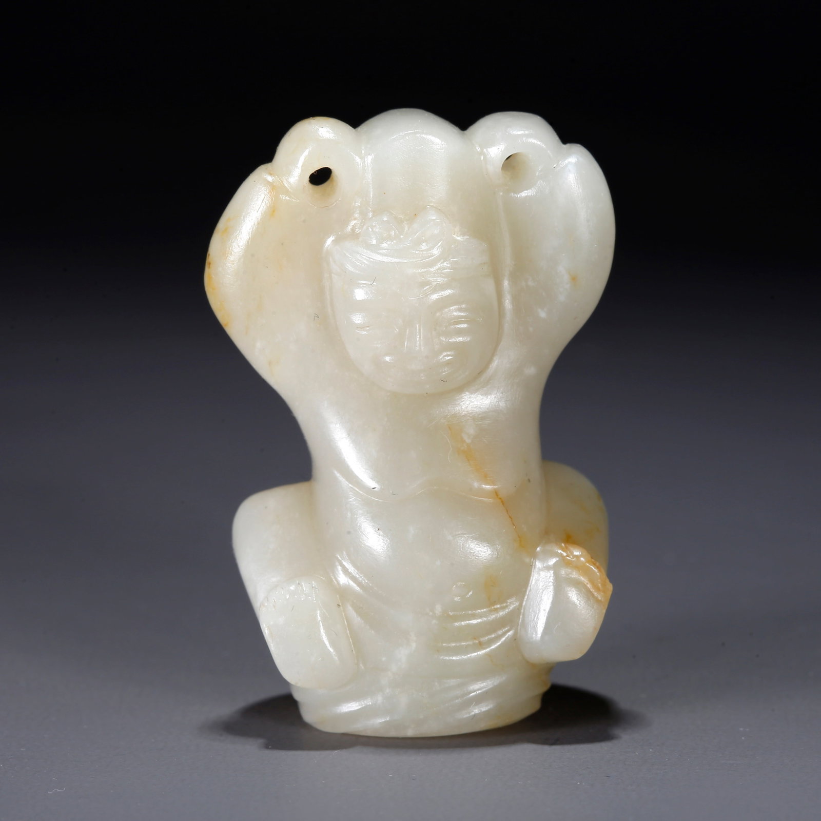 A CARVED HETIAN JADE FIGURINE PENDANT: Carved Hetian Jade Figurine Pendant
