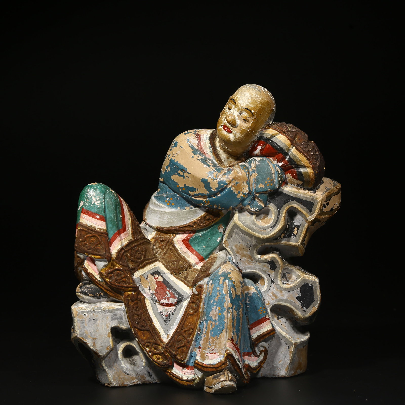 A POLYCHROME PAINTED CLAY SCULPTURE OF AN ARHAT (1 of 8)
