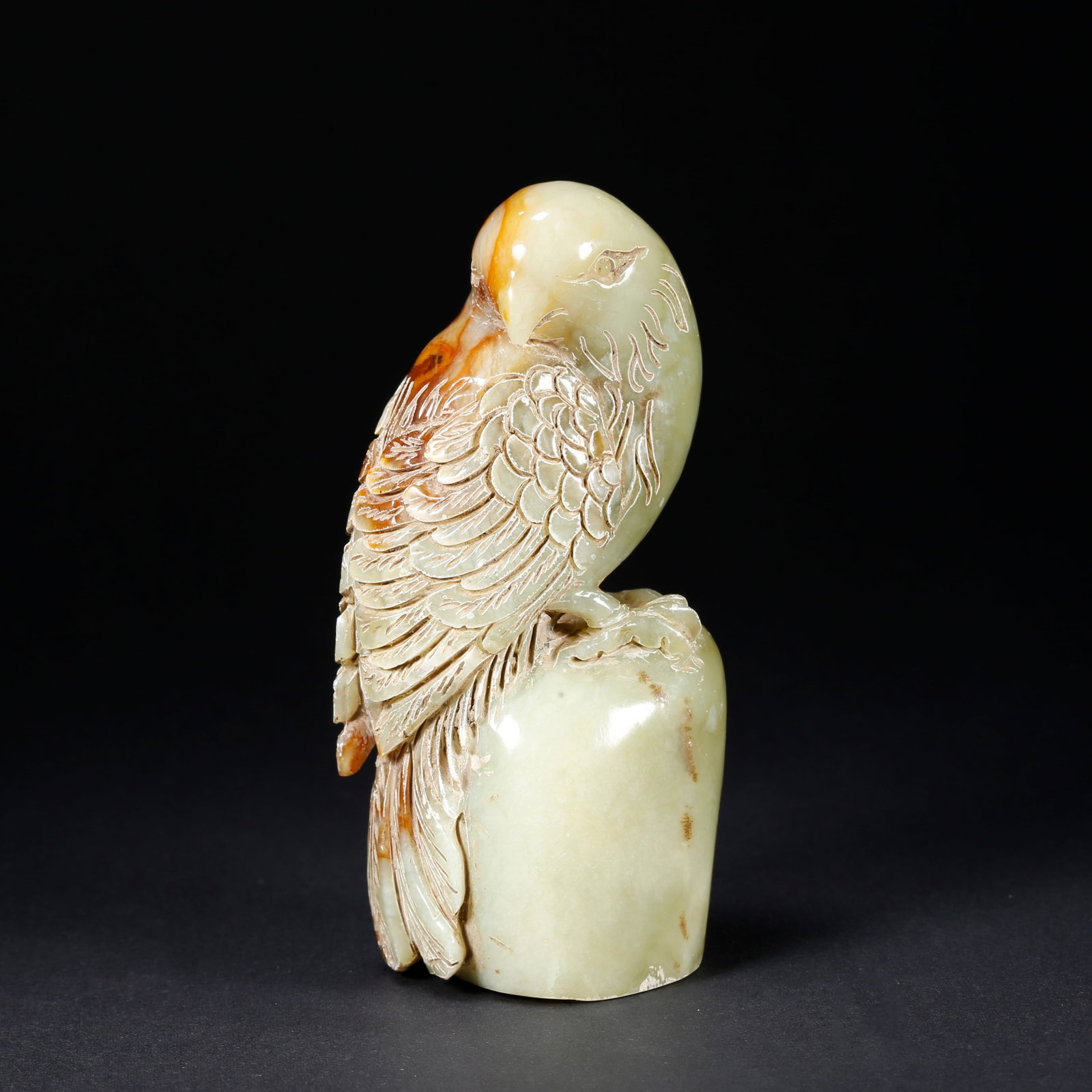A HETIAN JADE PARROT-SHAPED FIGURINE (1 of 10)