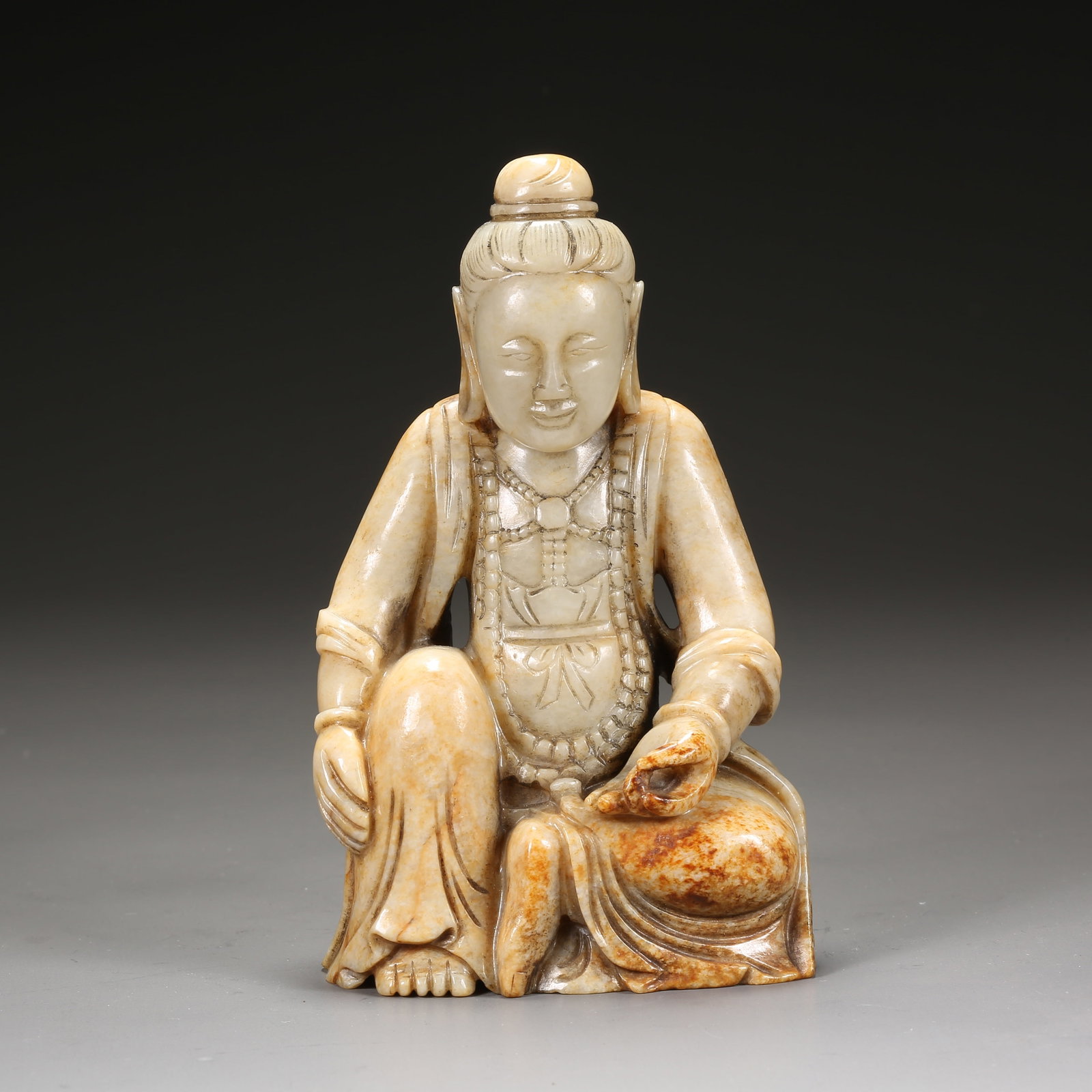 A HETIAN JADE SEATED BODHISATTVA: Hetian Jade Seated Bodhisattva