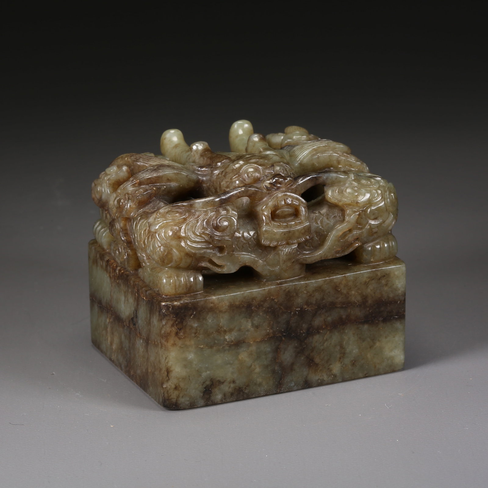 A HETIAN JADE DRAGON-HANDLE SEAL (1 of 8)