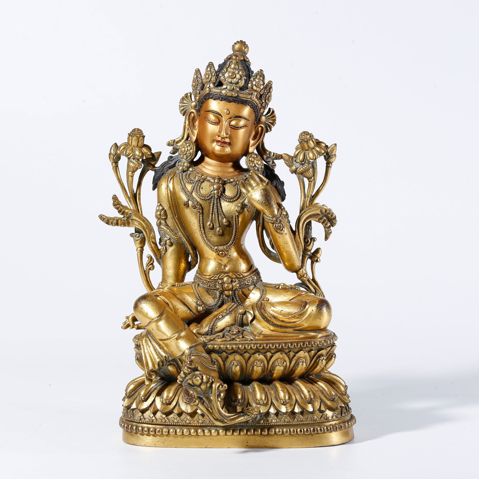 A GILDED BRONZE GREEN TARA STATUE: Gilded Bronze Green Tara Statue
