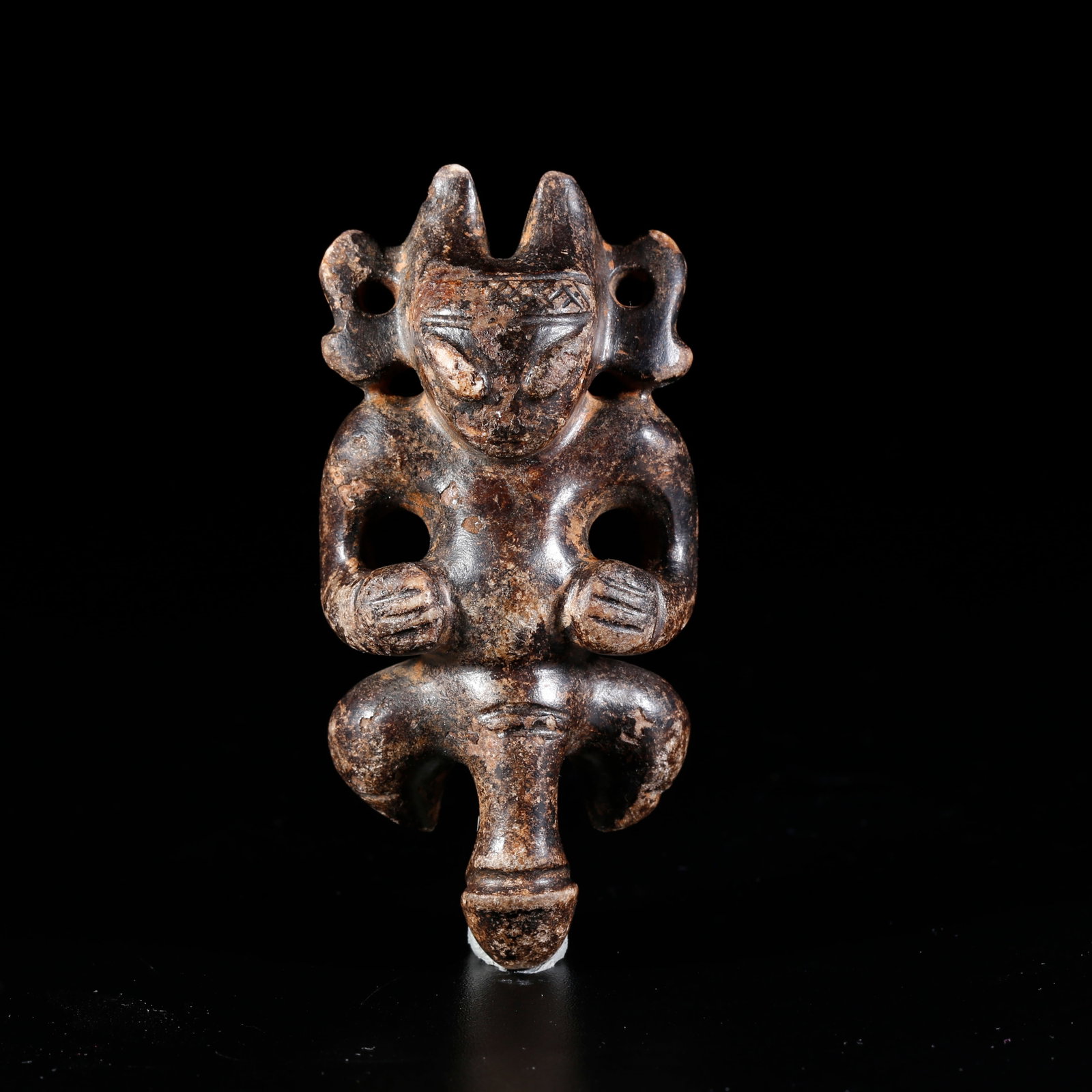 A ARCHAIC JADE CARVED SUN DEITY ORNAMENT (1 of 9)