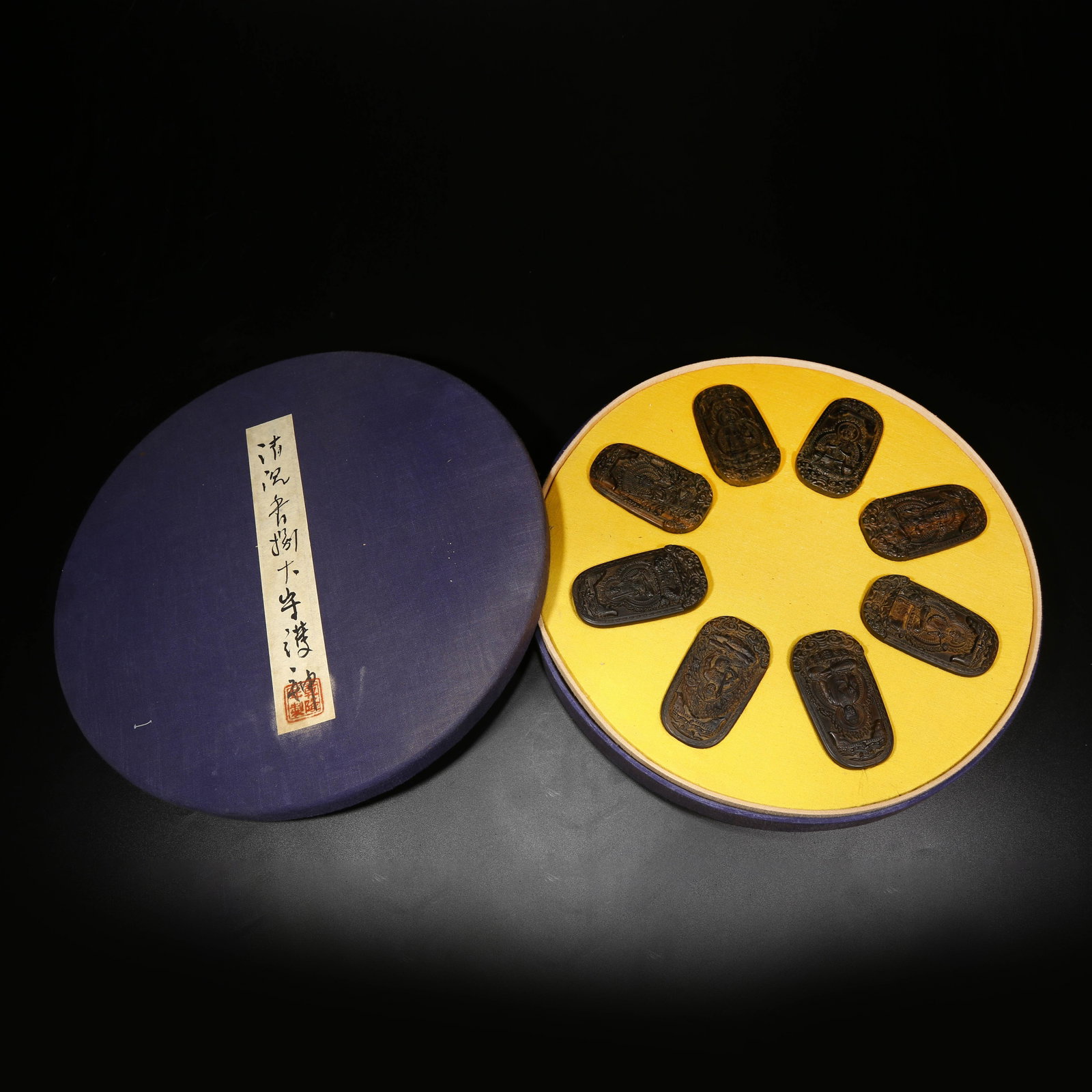 A SET OF AGARWOOD BUDDHA PLAQUES (1 of 8)
