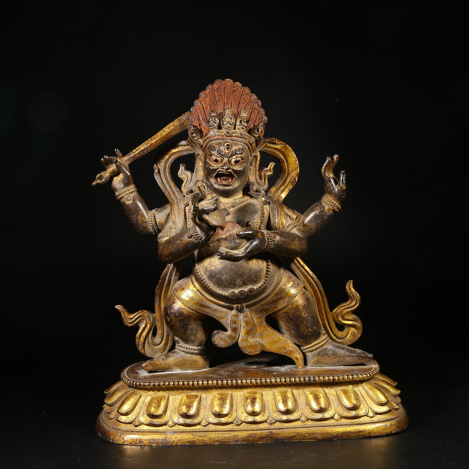 A GILT-BRONZE STATUE OF FOUR-ARMED MAH?K?LA (1 of 8)