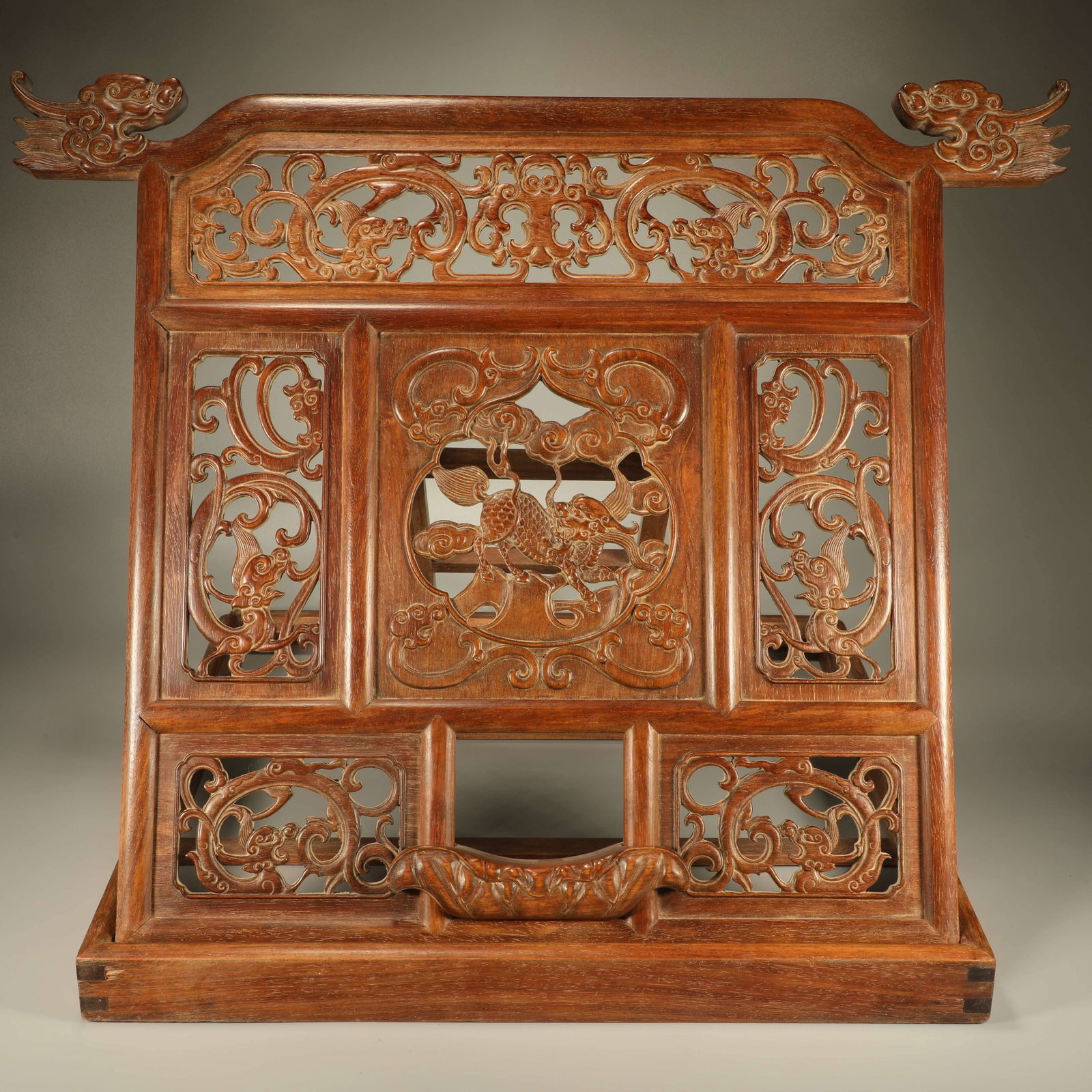 A HUANGHUALI MIRROR FRAME CARVED WITH KYLIN PATTERN: Huanghuali mirror frame carved with kylin pattern
