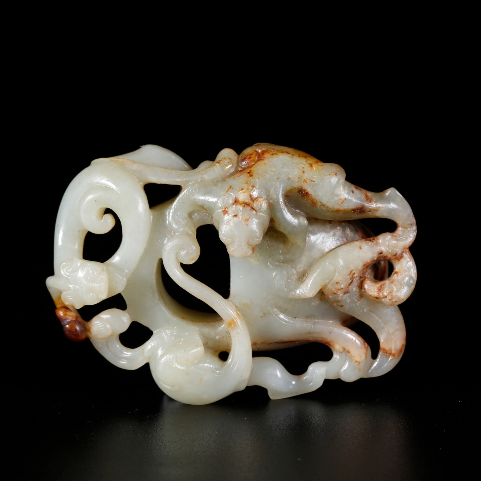 A HETIAN JADE CARVED ANIMAL-MOTIF CHICKEN-HEART PENDANT (1 of 10)