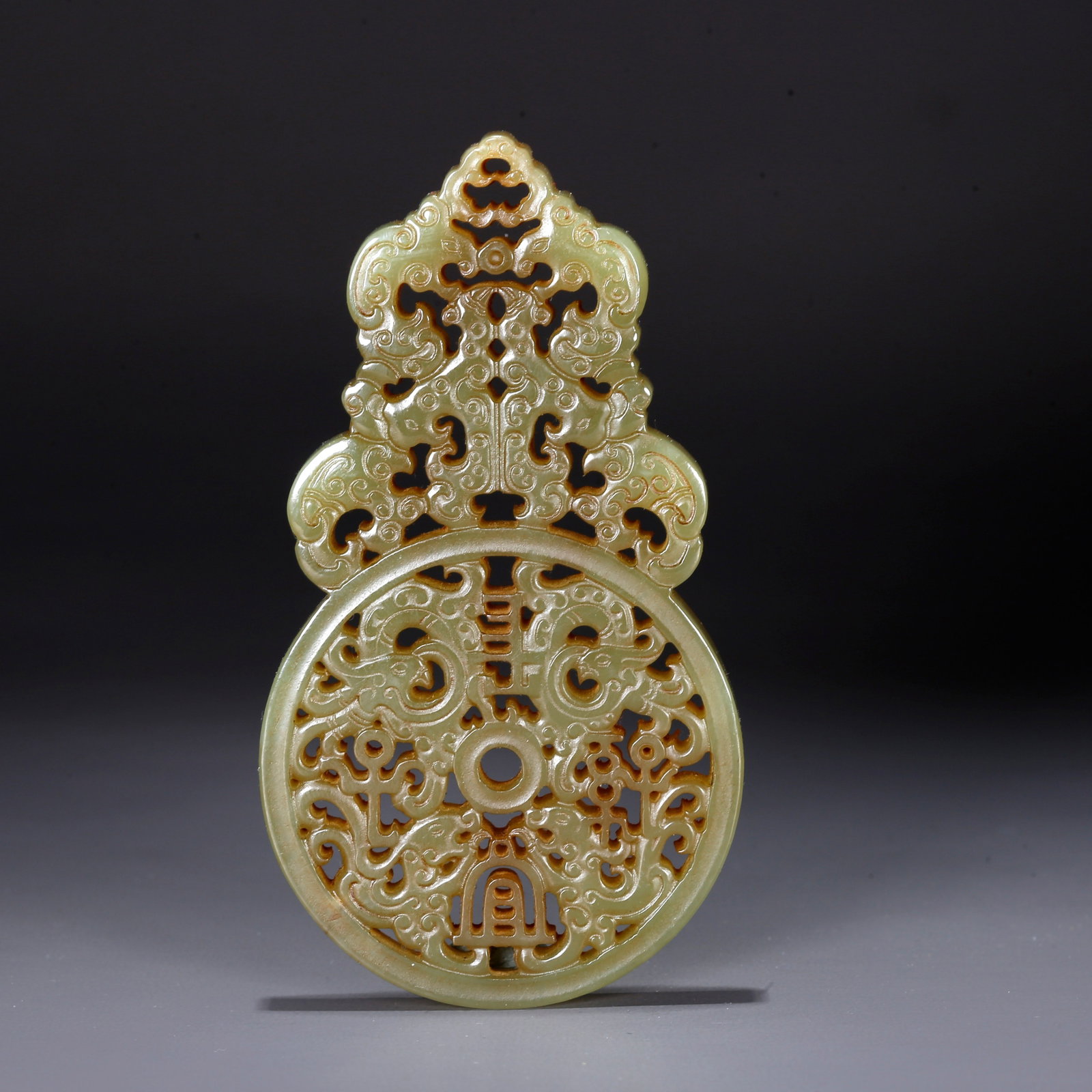 A CARVED HETIAN JADE PENDANT WITH DRAGON AND PHOENIX PATTERN (1 of 10)