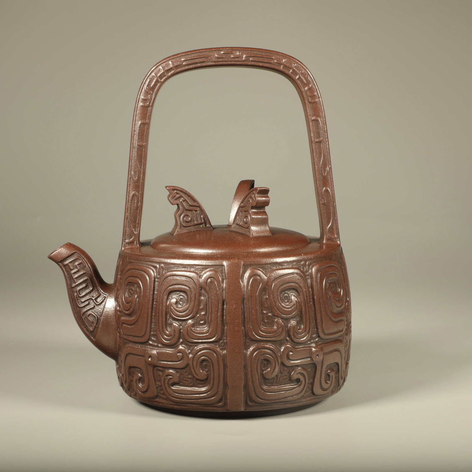 A PURPLE CLAY BEAST MASK HANDLED POT (1 of 6)