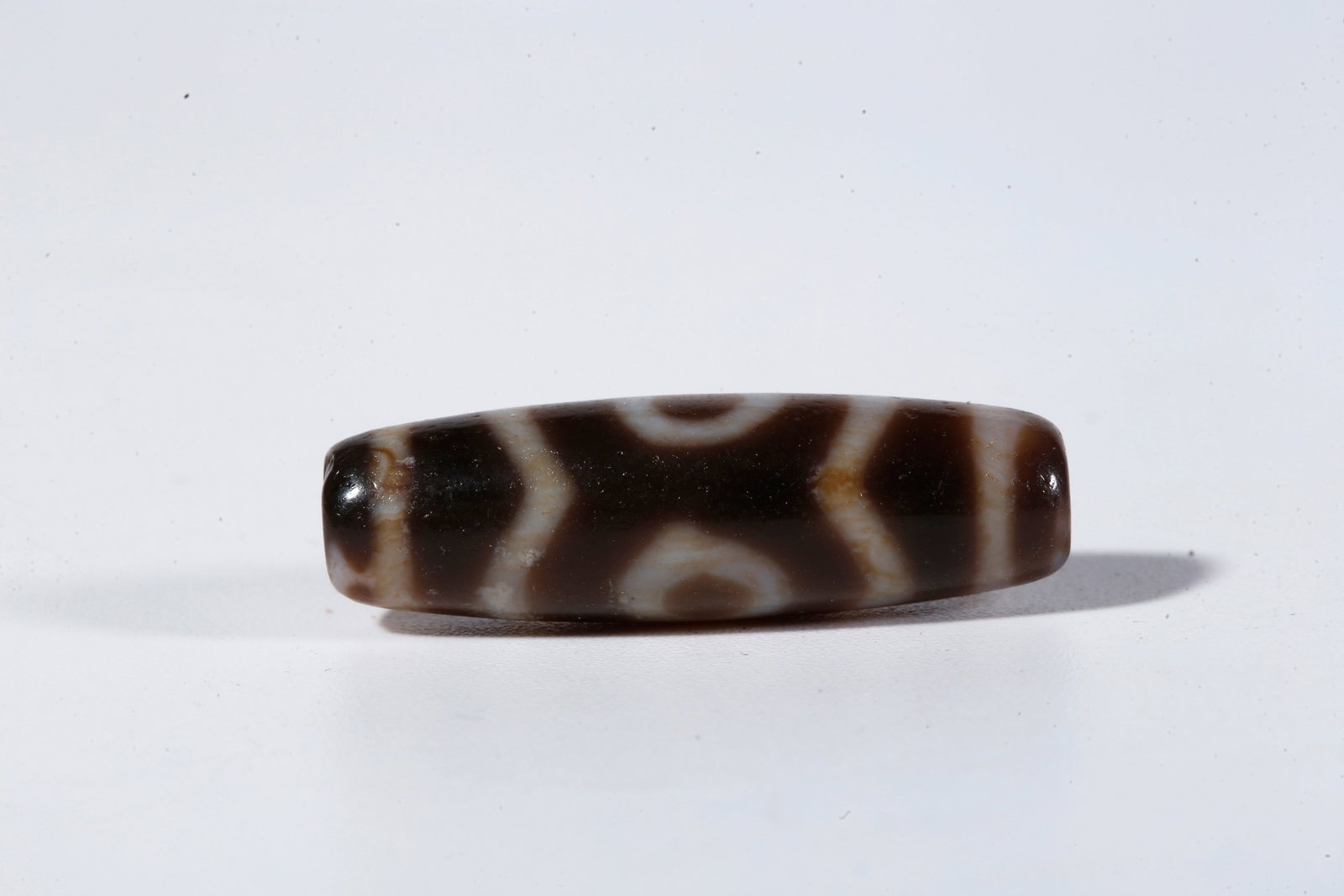 A THREE-EYED DZI BEAD - 3