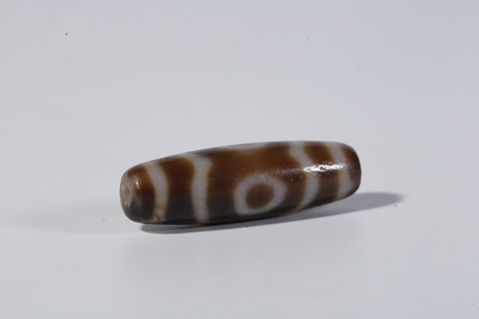 A THREE-EYED DZI BEAD - 6
