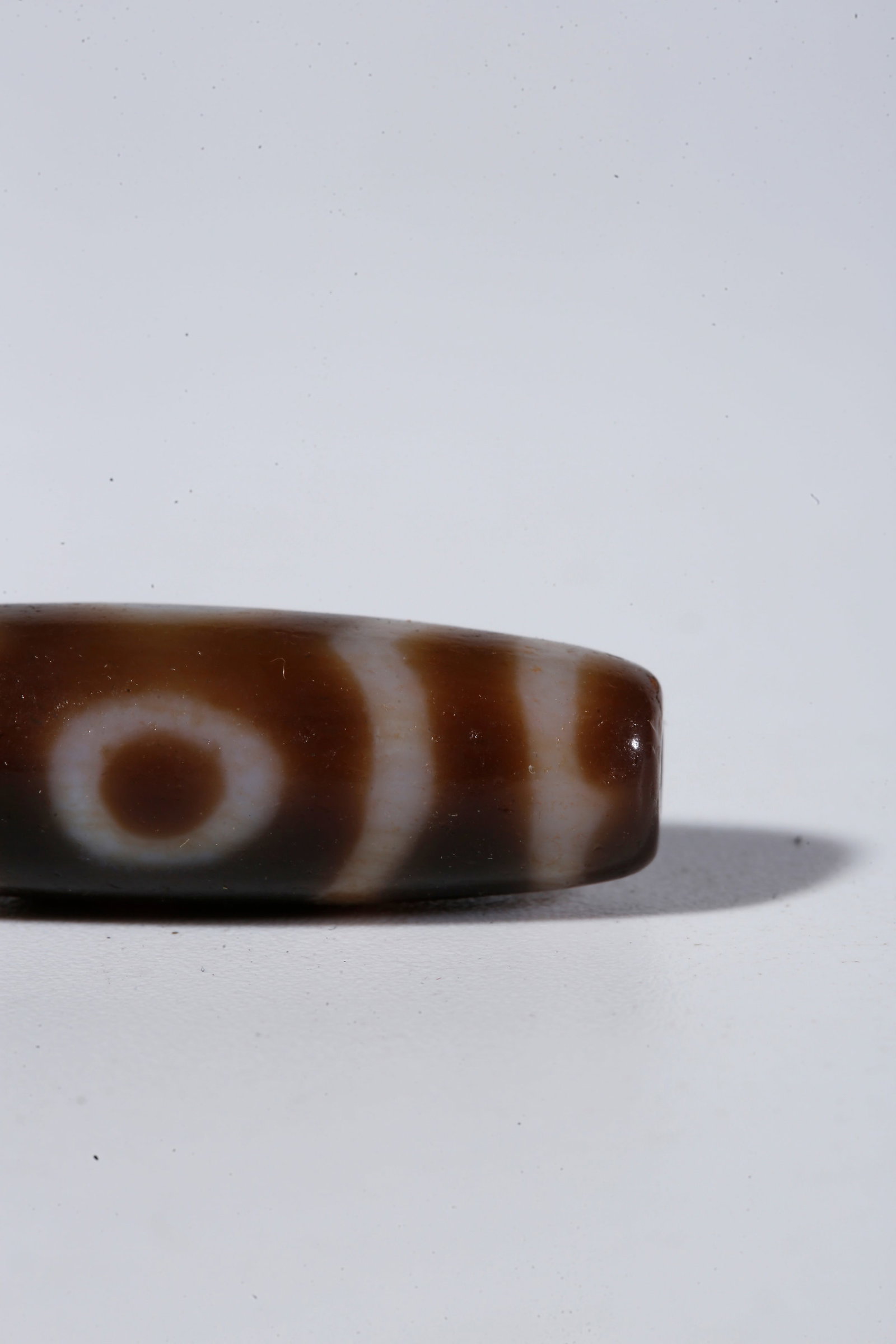 A THREE-EYED DZI BEAD - 7
