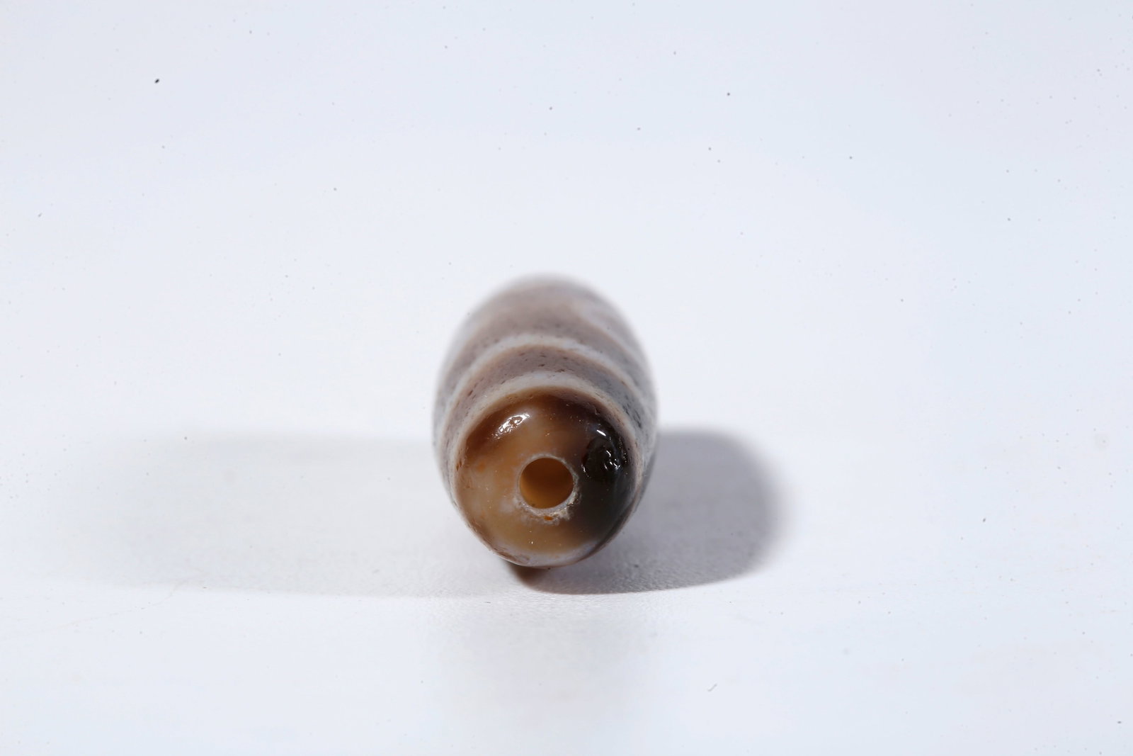 A THREE-EYED DZI BEAD - 8