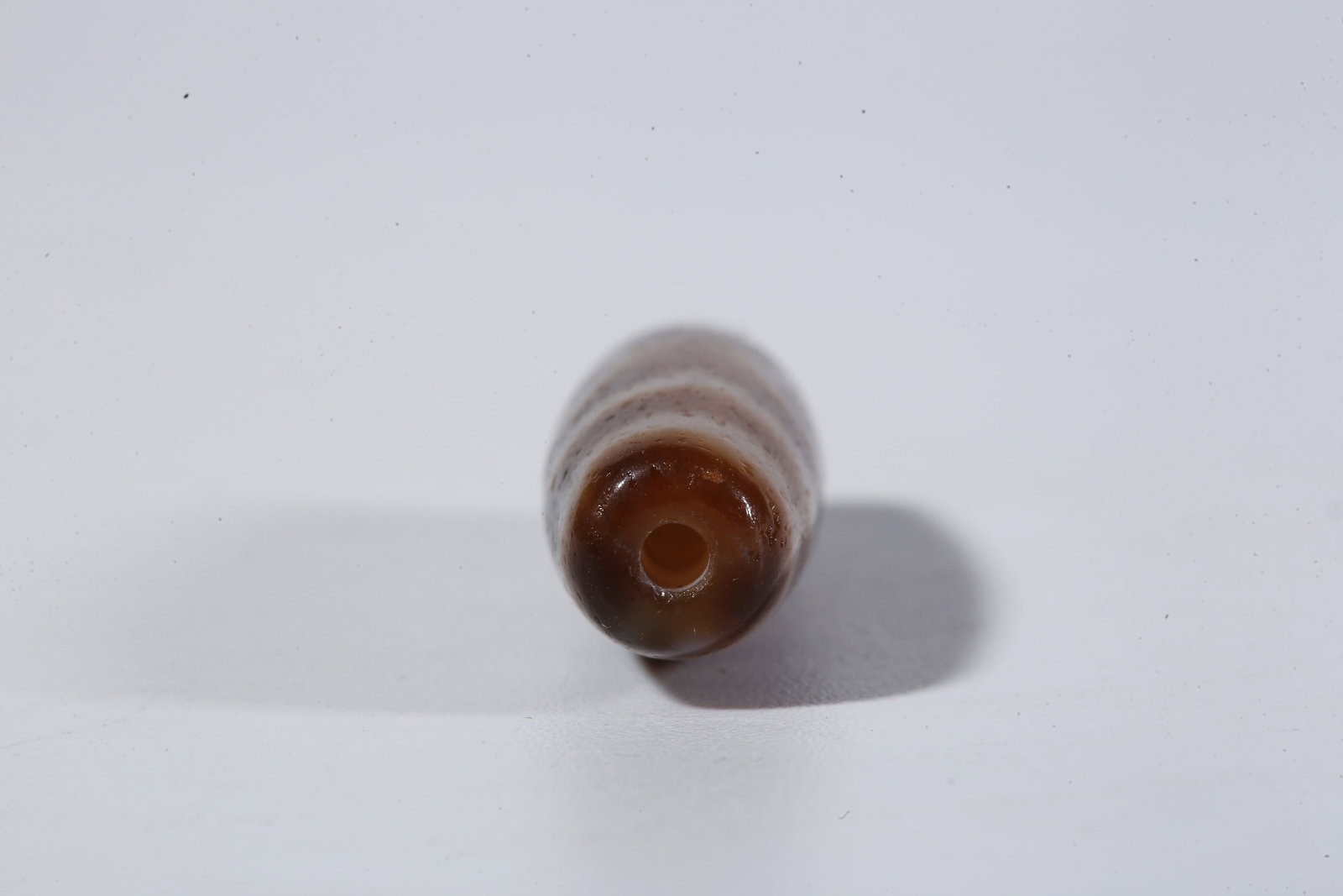 A THREE-EYED DZI BEAD - 9