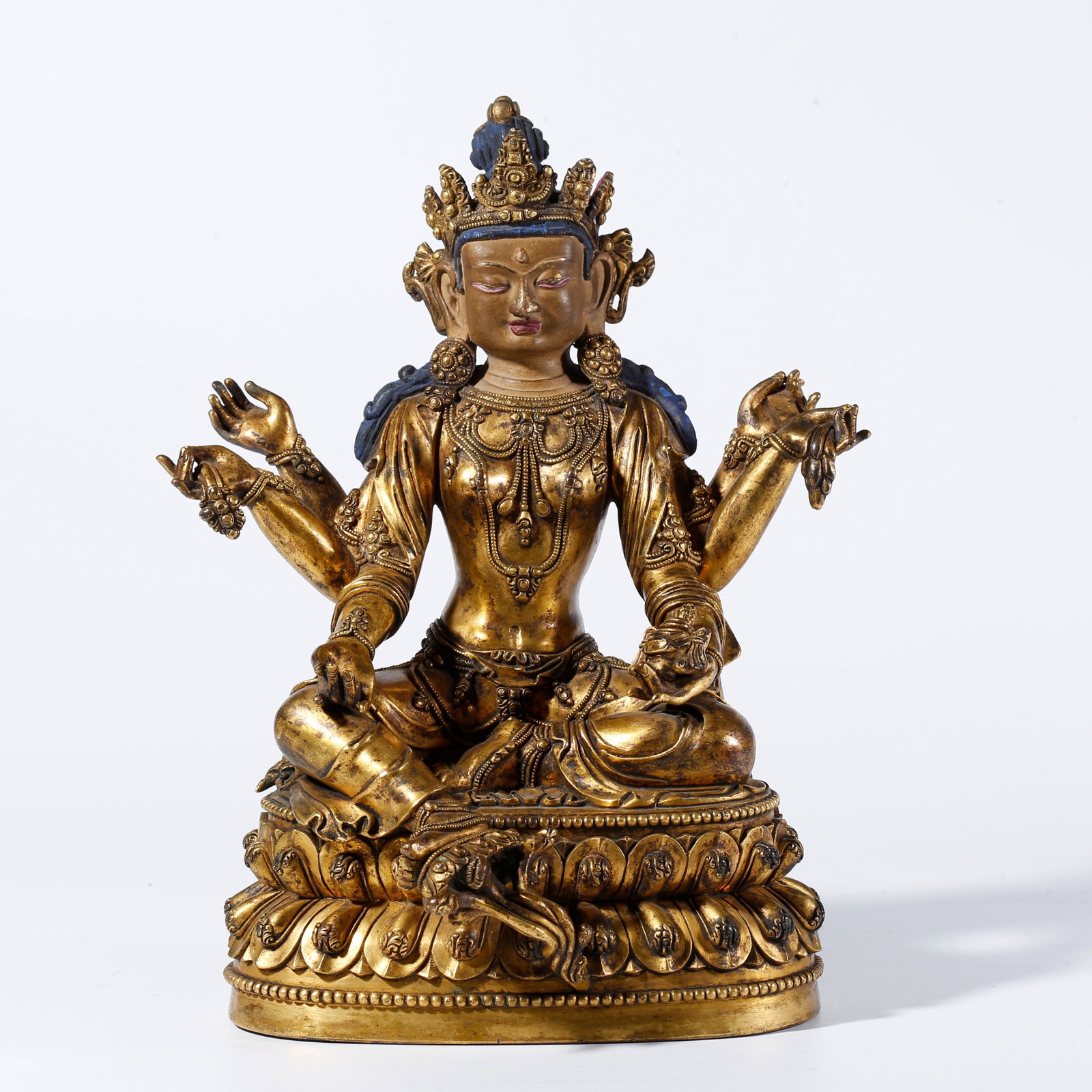 A GILDED BRONZE SIX-ARMED AVALOKITESHVARA STATUE: Gilded Bronze Six-Armed Avalokiteshvara Statue